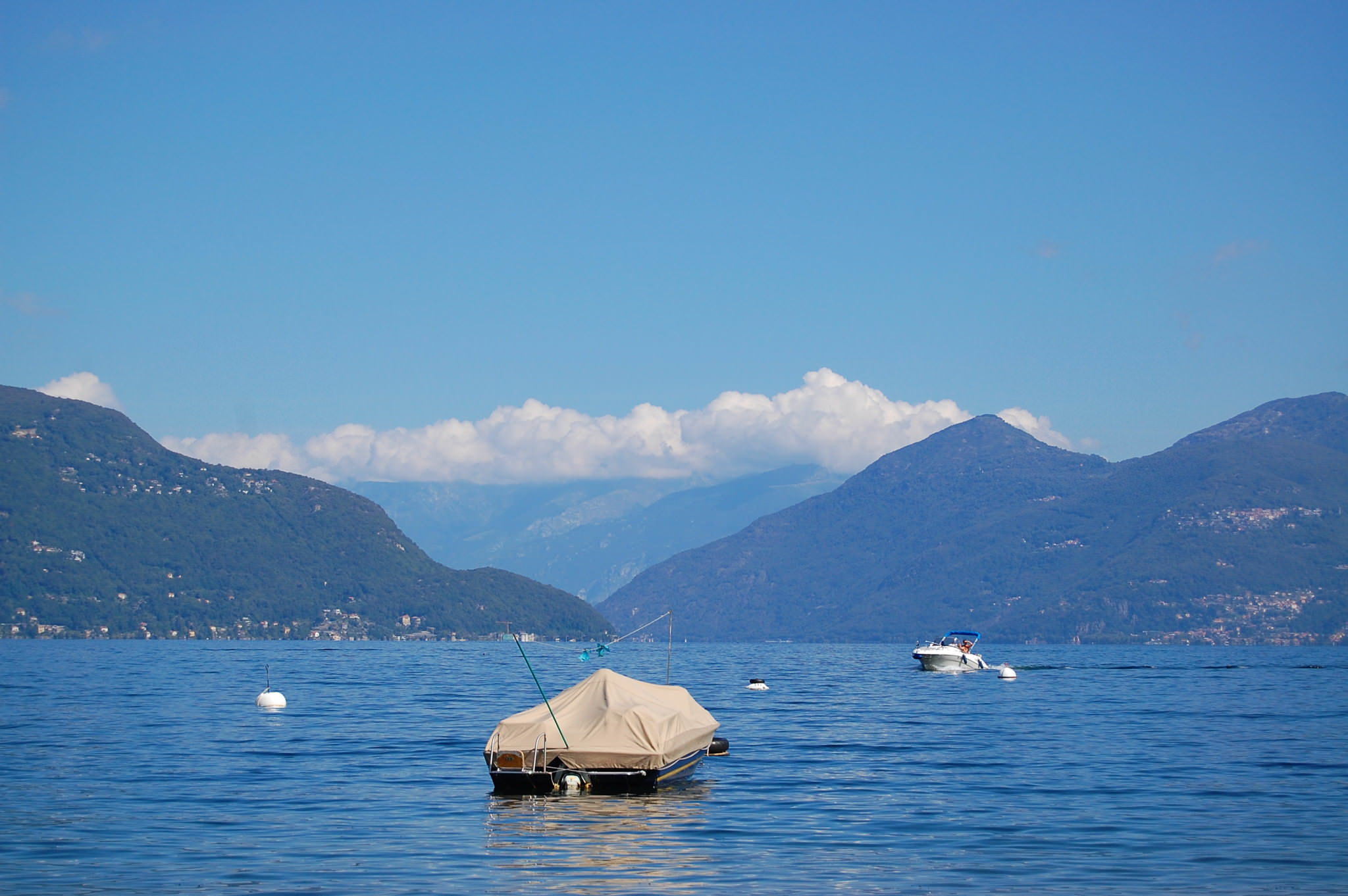 Boat on Lake Maggiore, Italy, with mountains in the background.