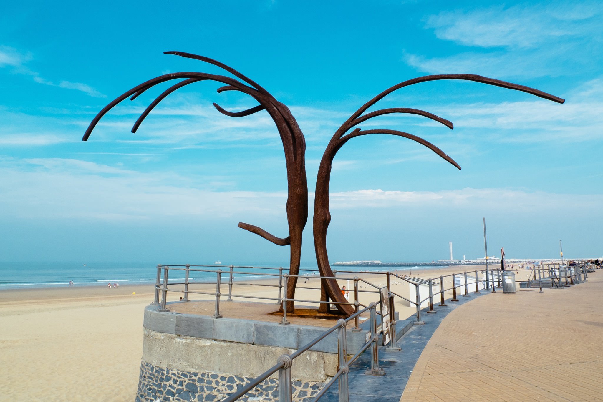Modern metal sculpture on a seaside promenade in Oostende, Belgium.