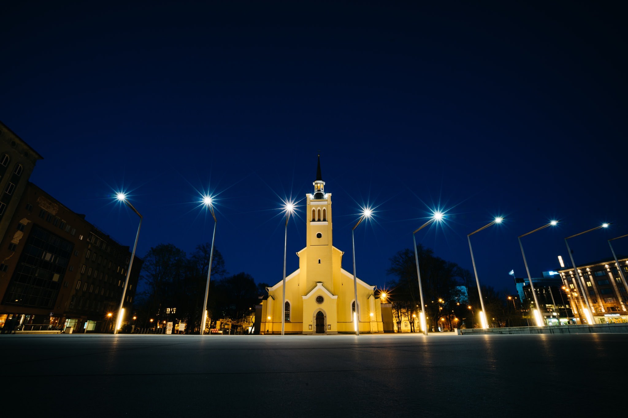Illuminated St. John's Church in Tallinn at night.