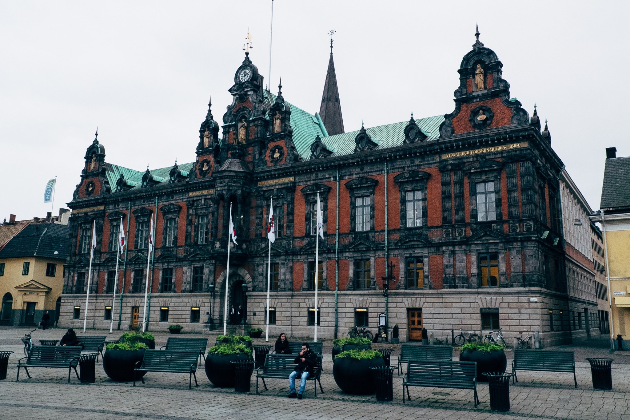 Malmö town hall, a large brick building with a green roof and many windows.