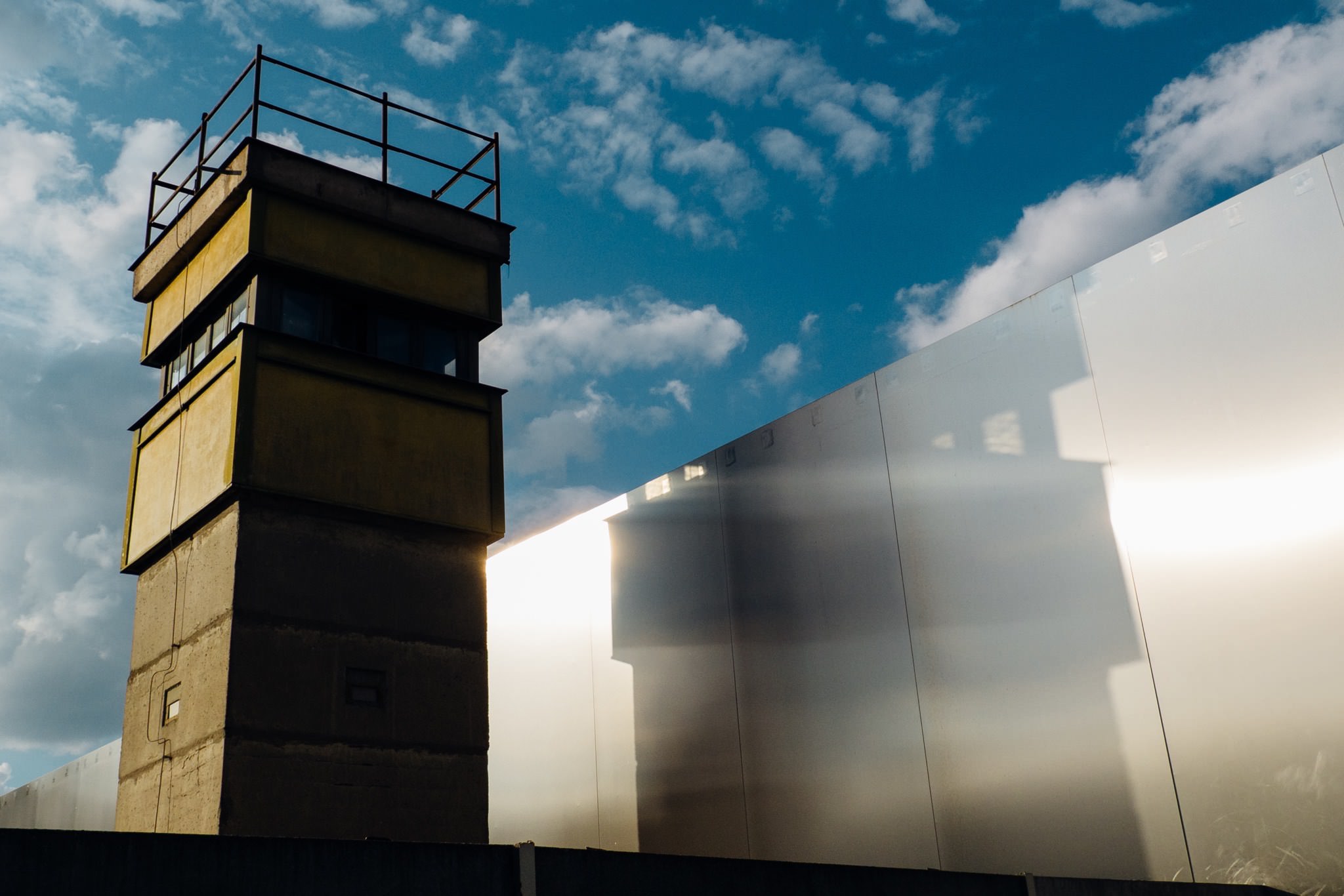 Berlin Wall watchtower and wall segment.