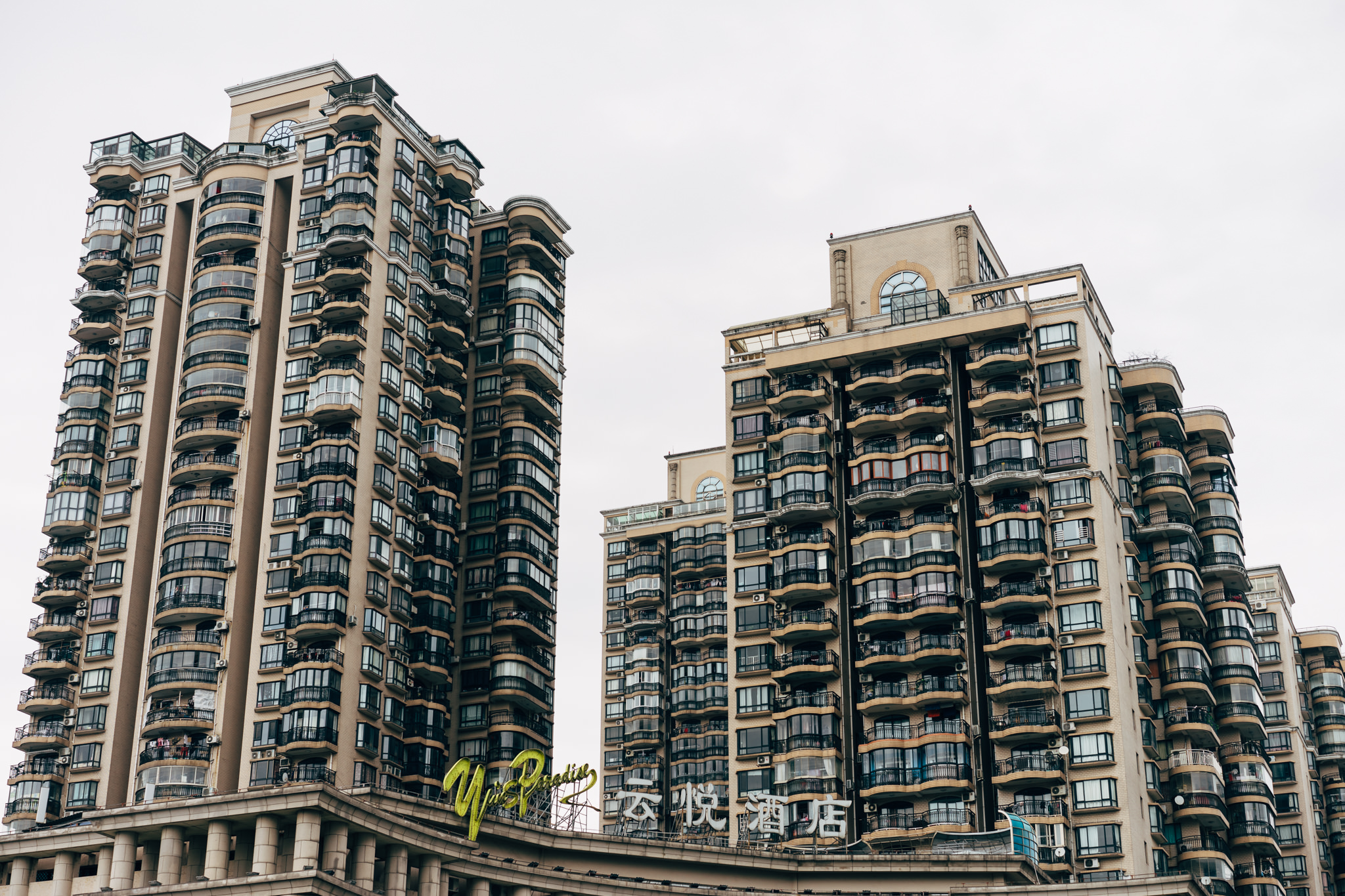 Two tall residential buildings in Shanghai, China.