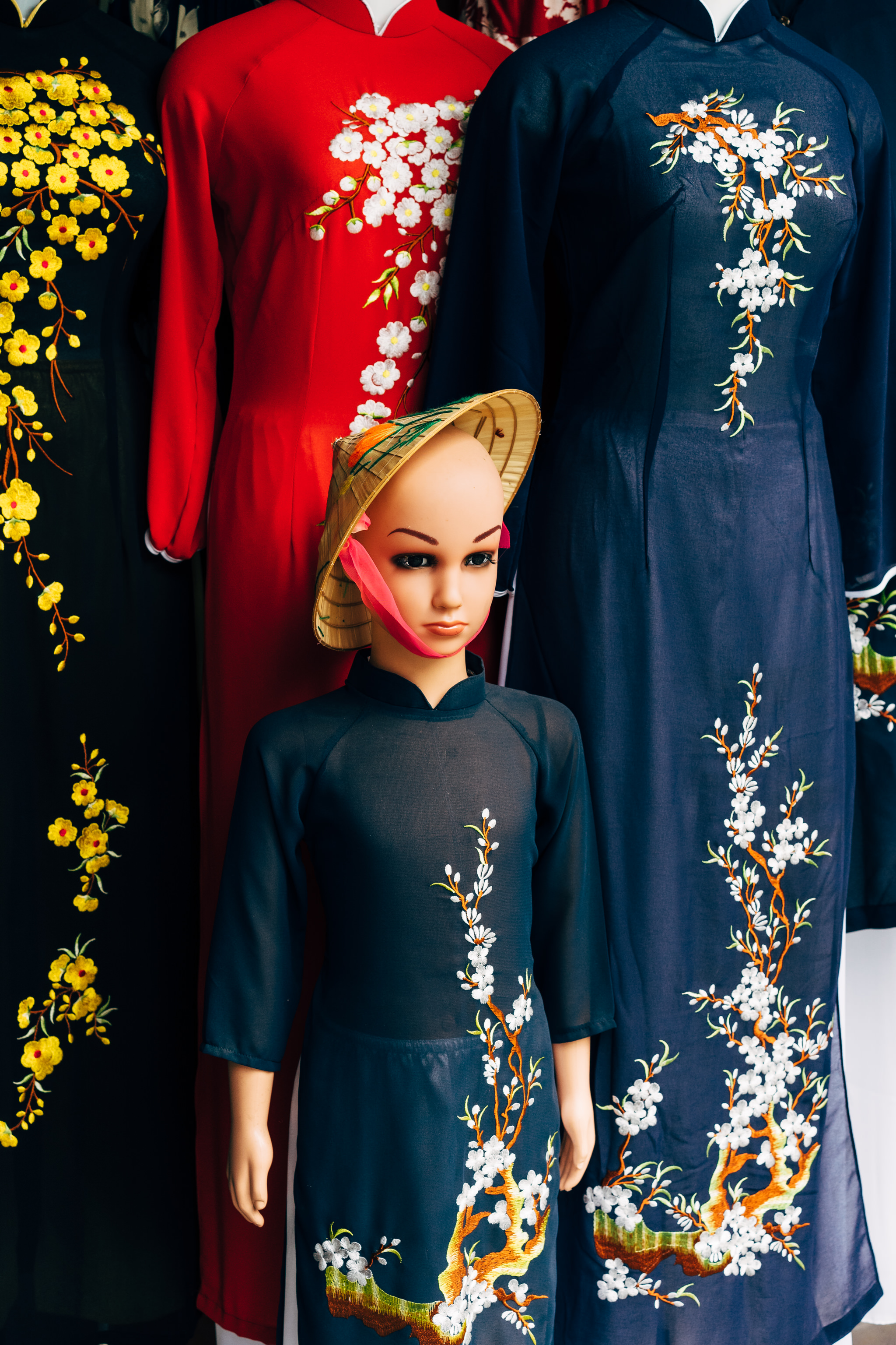Mannequin in Ao Dai with flower embroidery, Hoi An, Vietnam.