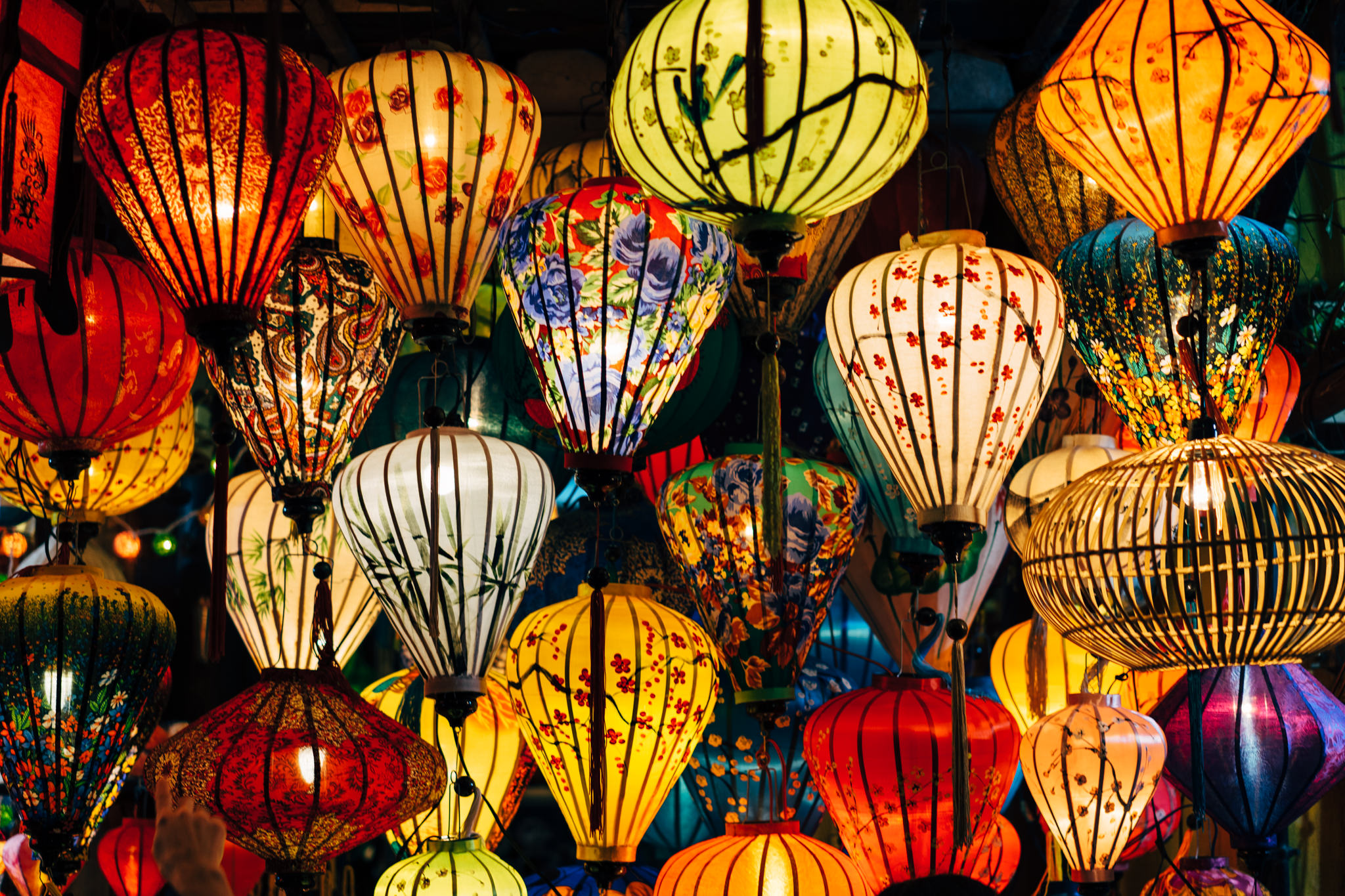 Many colorful illuminated lanterns hanging in Hoi An.