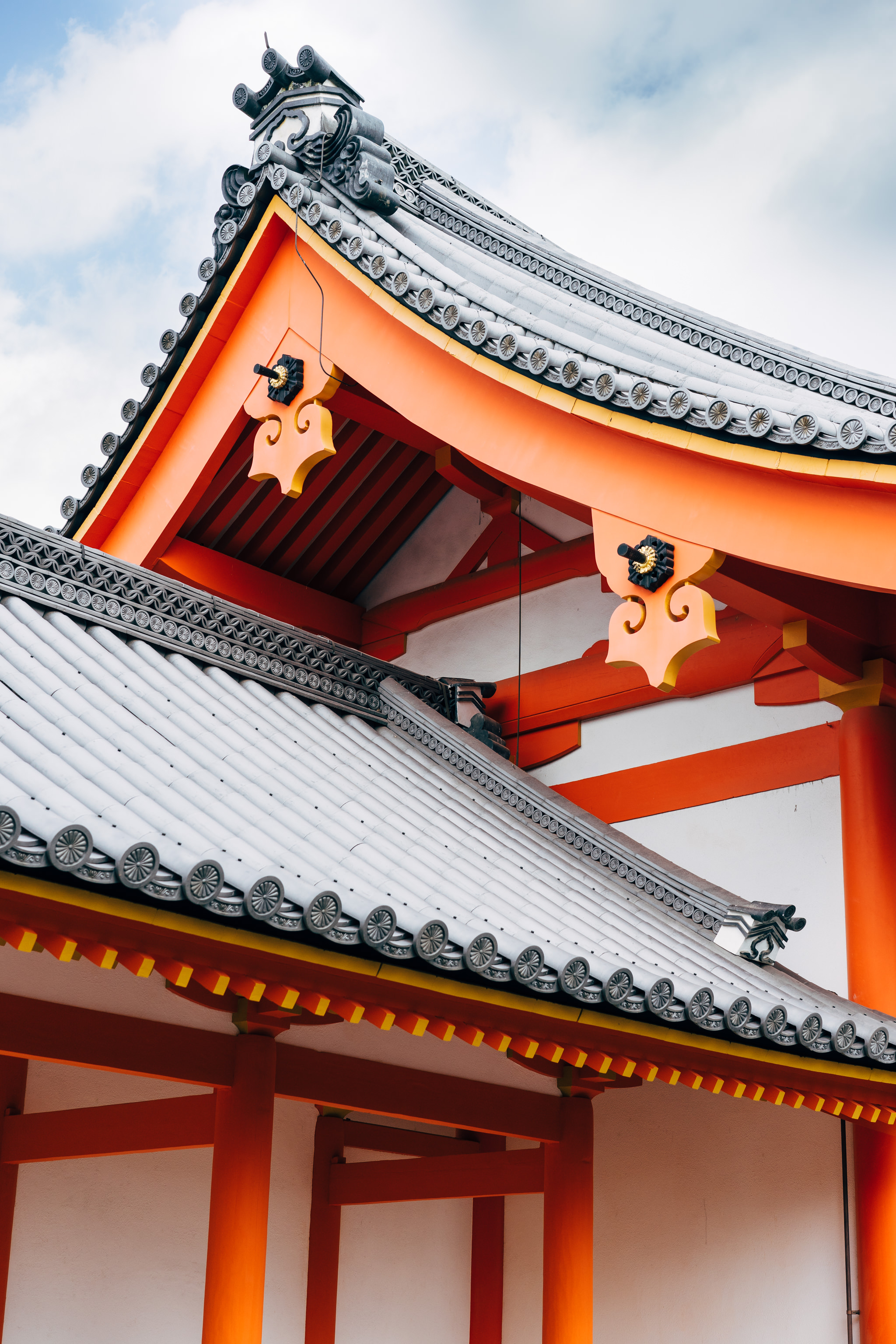 Kyoto Gosho palace roof detail: orange beams and grey tiles.