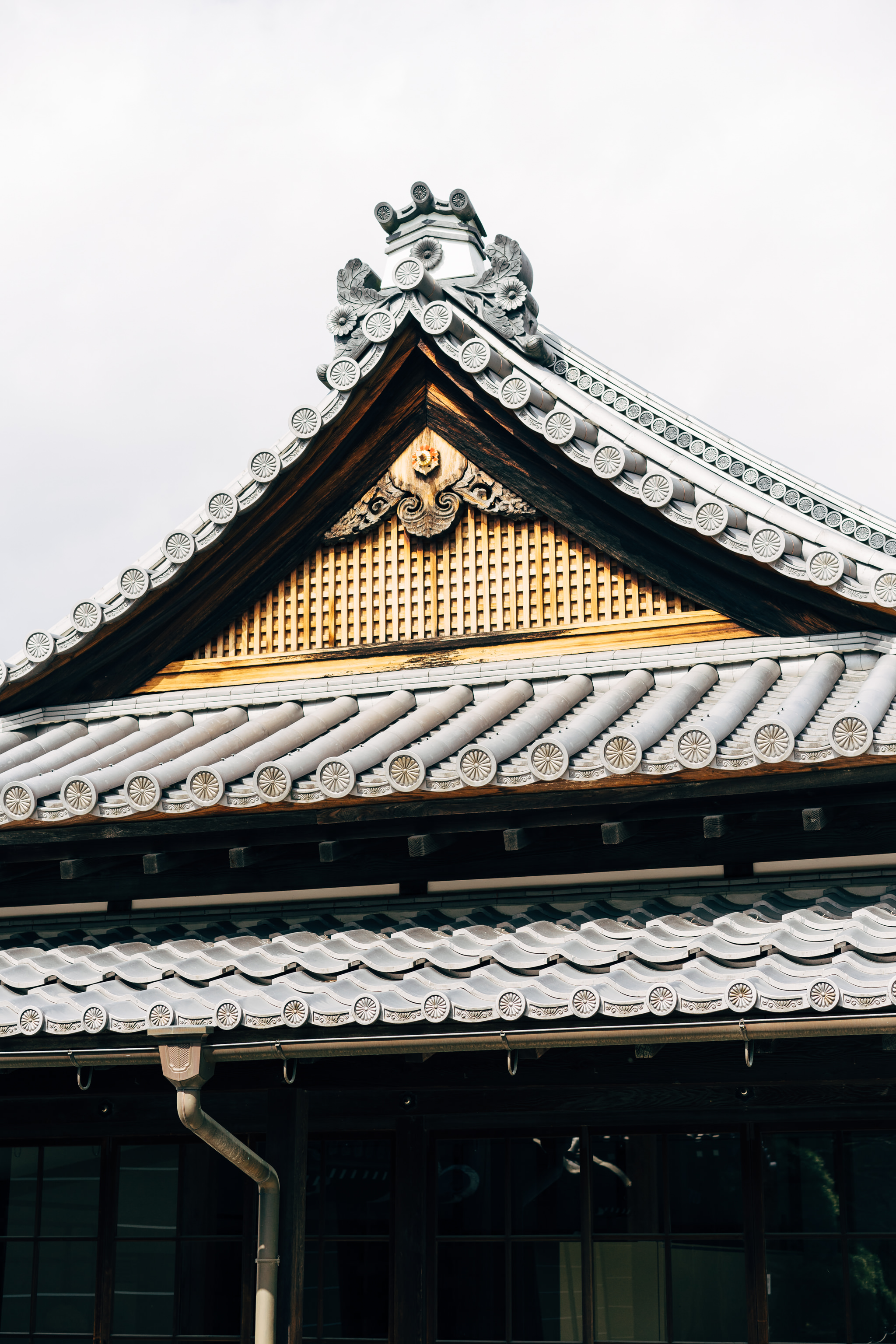 Close-up of ornate roof detail at Kyoto Imperial Palace.