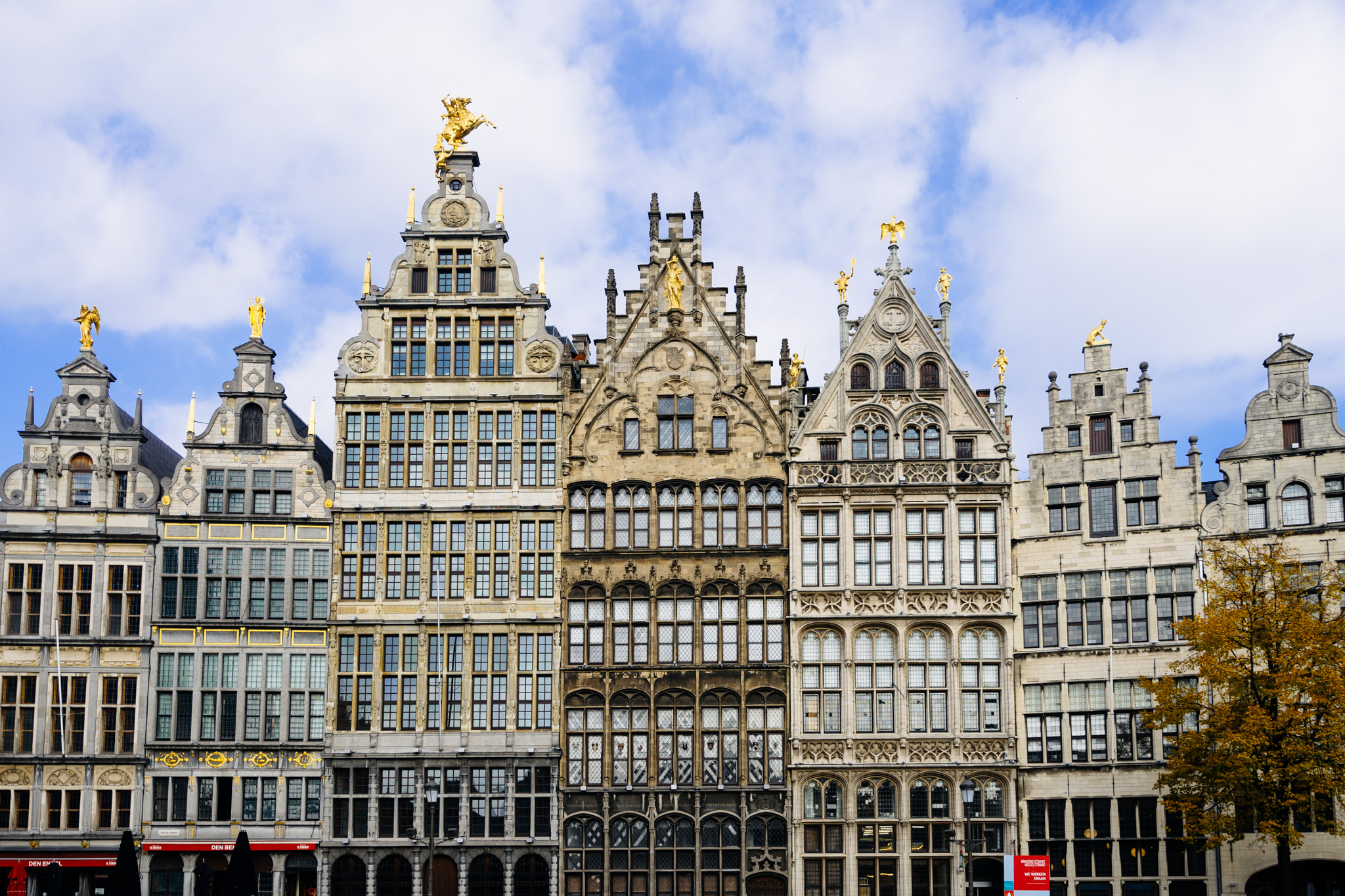 Antwerp, Belgium: row of ornate, historic buildings with gilded statues.