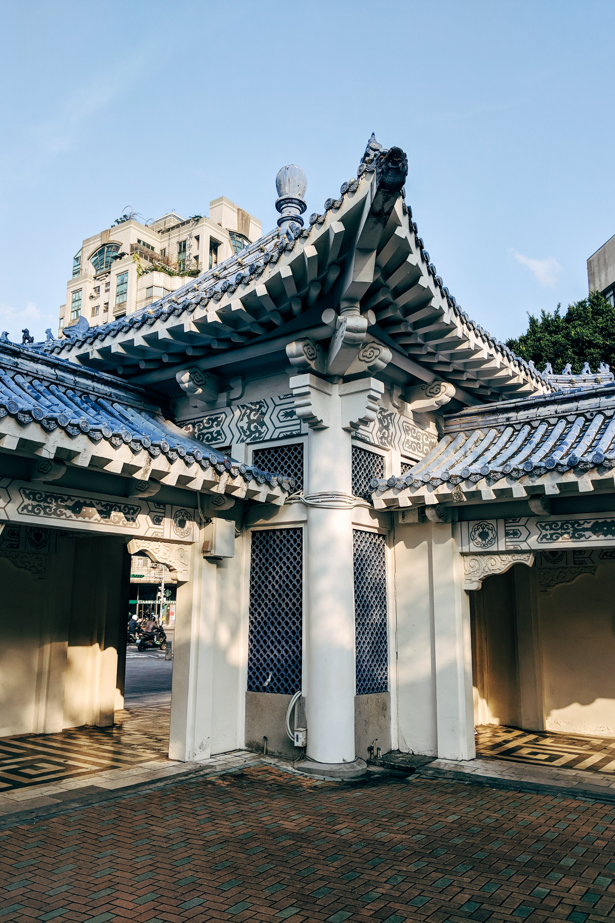 Chiang Kai-shek Memorial Hall wall detail: blue-tiled roof and ornate white structure.
