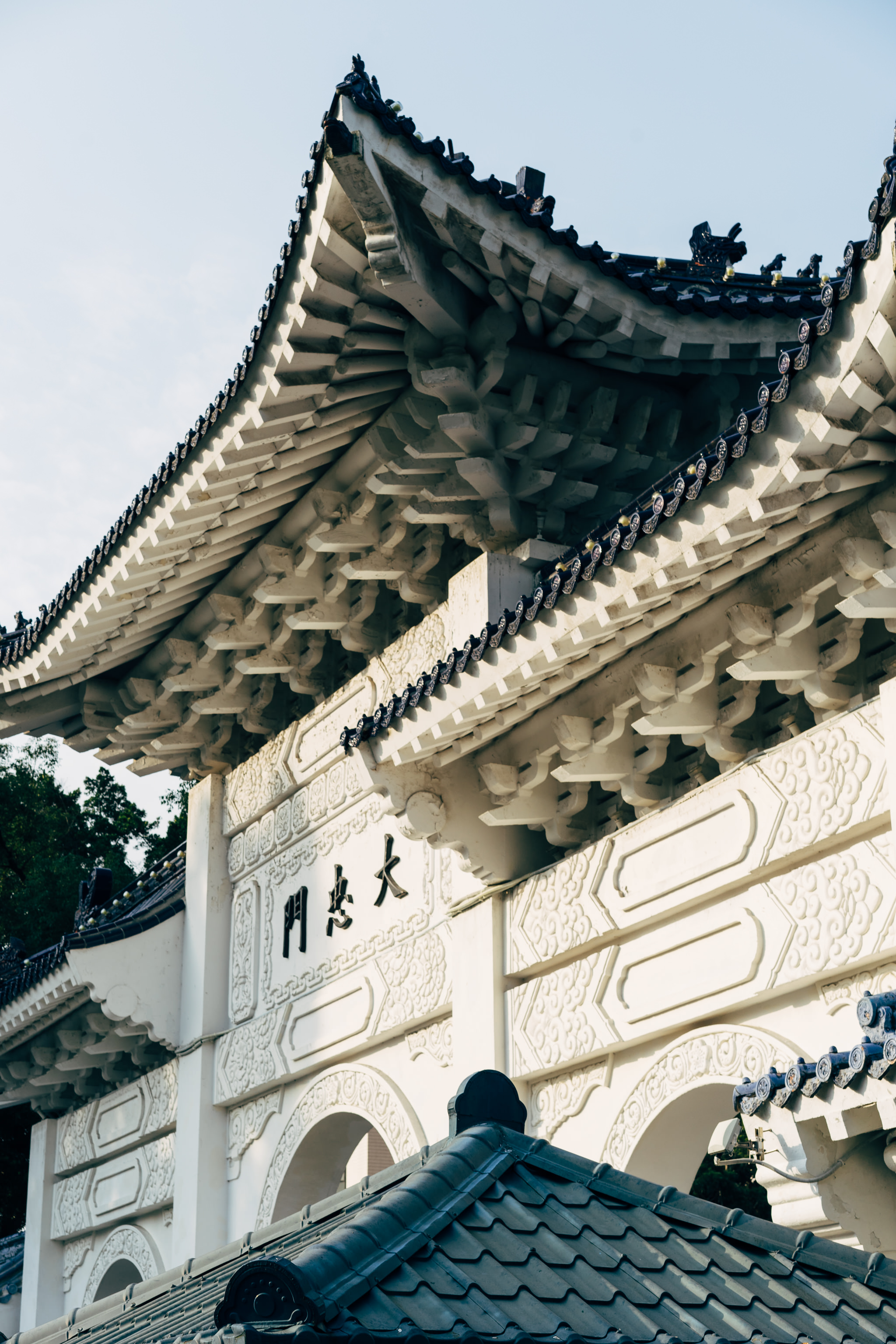 Close-up of ornate white wall and roofline of Chiang Kai-shek Memorial Hall.