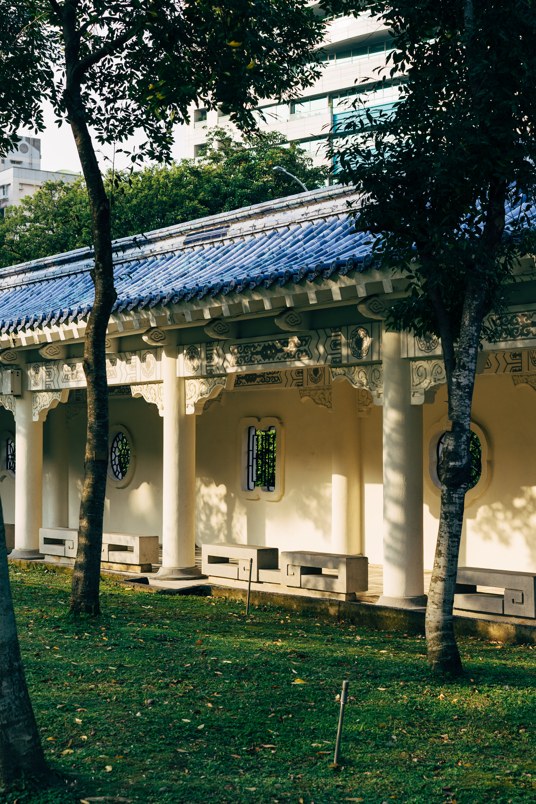 Chiang Kai-shek Memorial Hall wall with blue roof and ornate detailing.