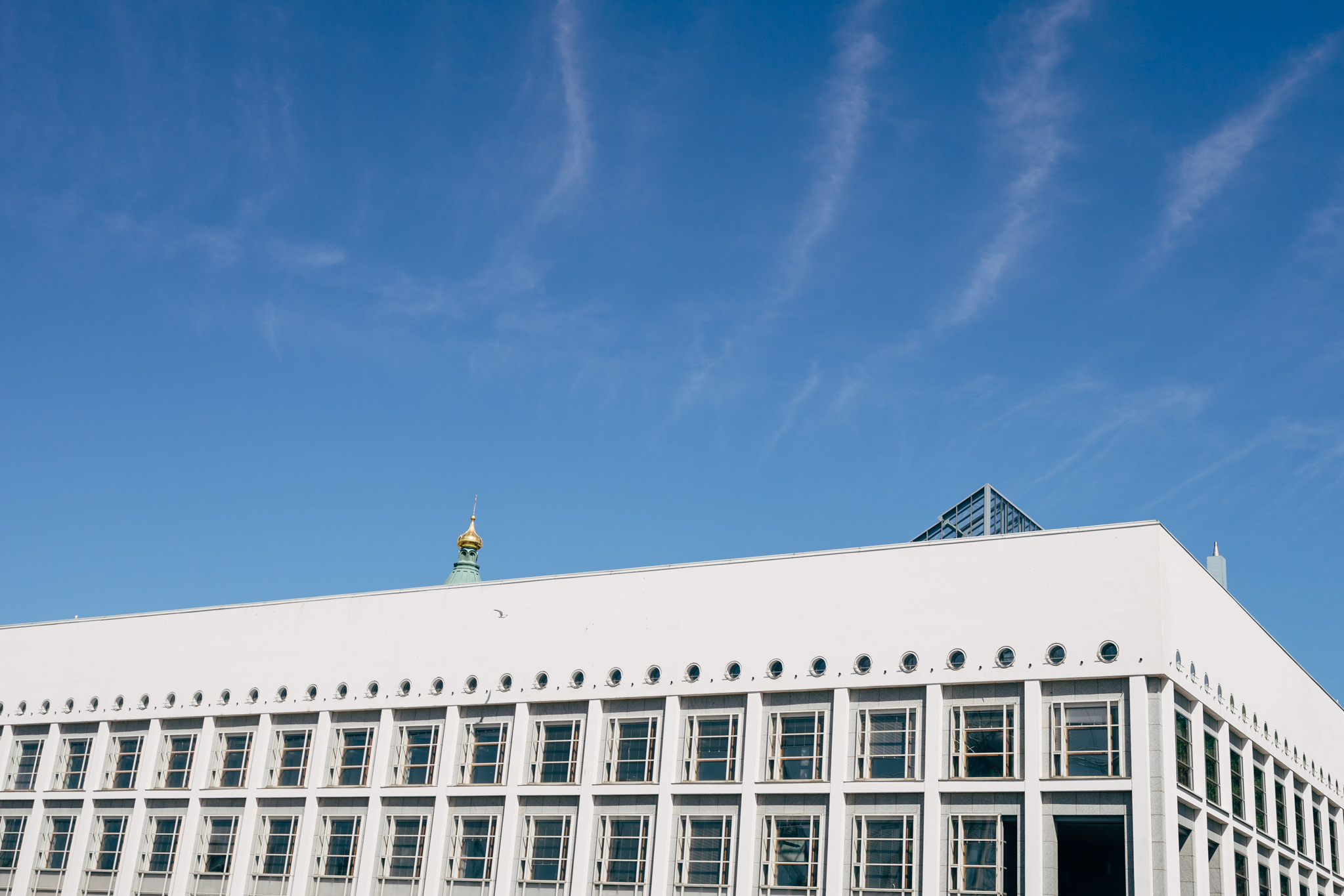 White building in Helsinki against a blue sky.