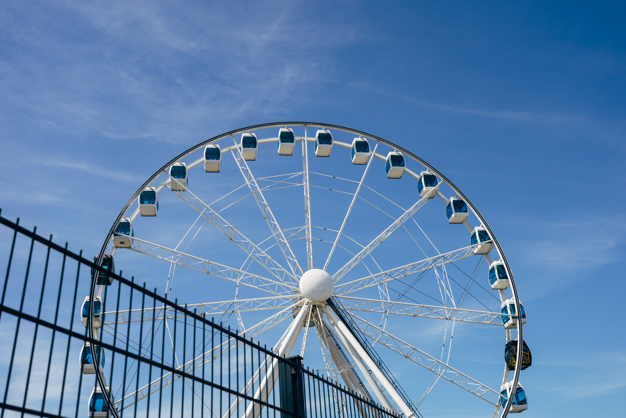 Helsinki Ferris wheel against a blue sky.