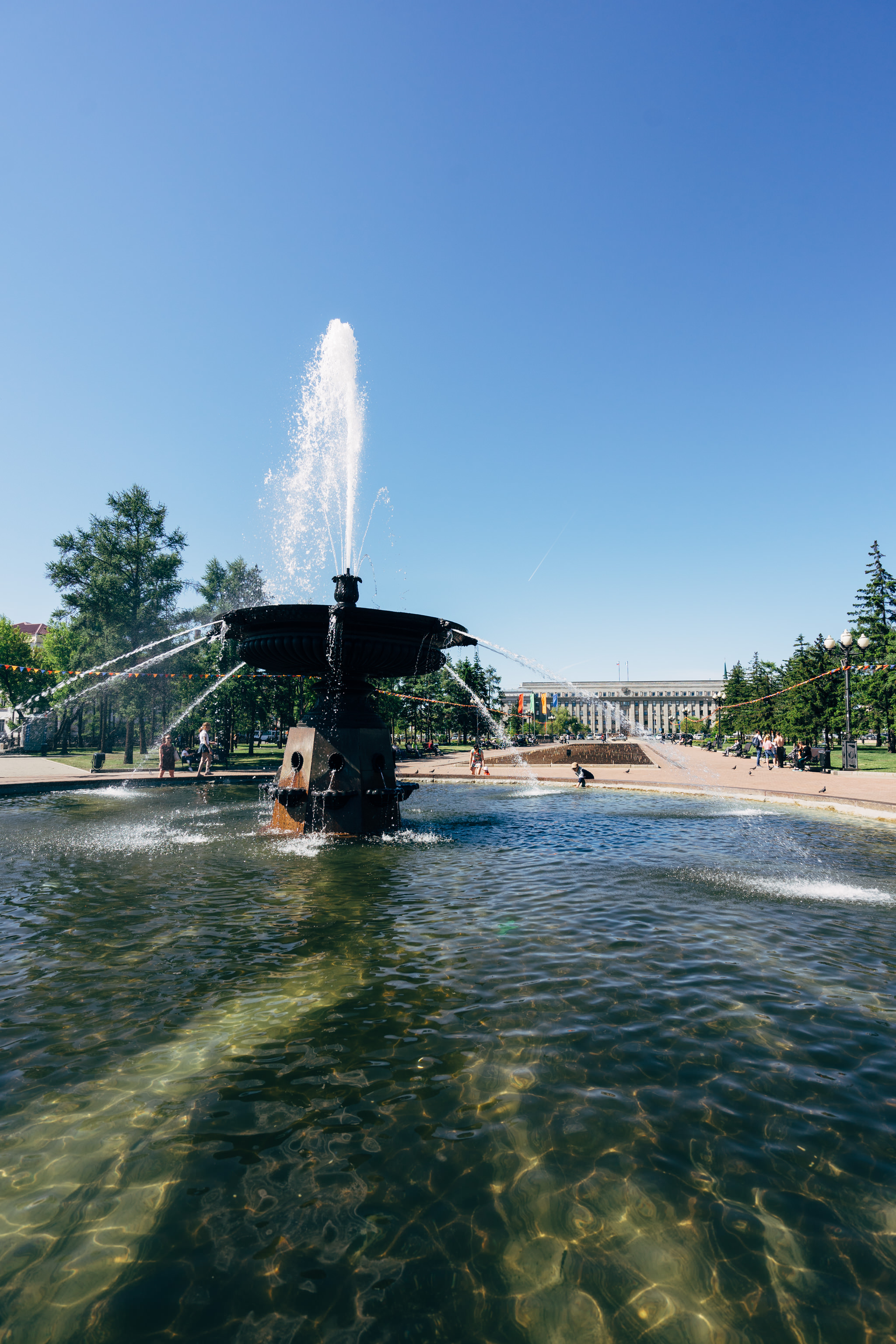 Fountain in a Siberian park on a sunny day.