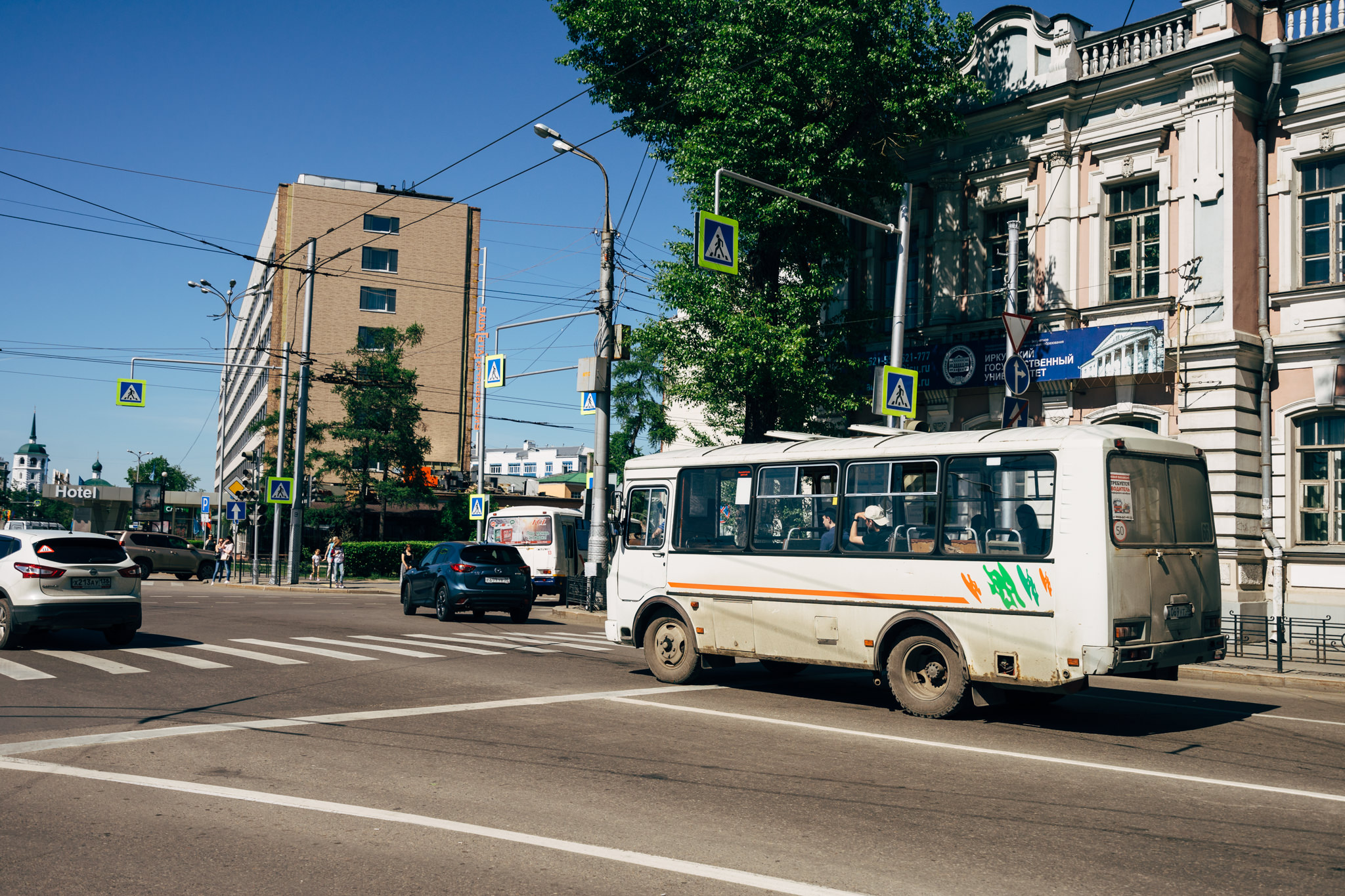 White bus at Irkutsk intersection.