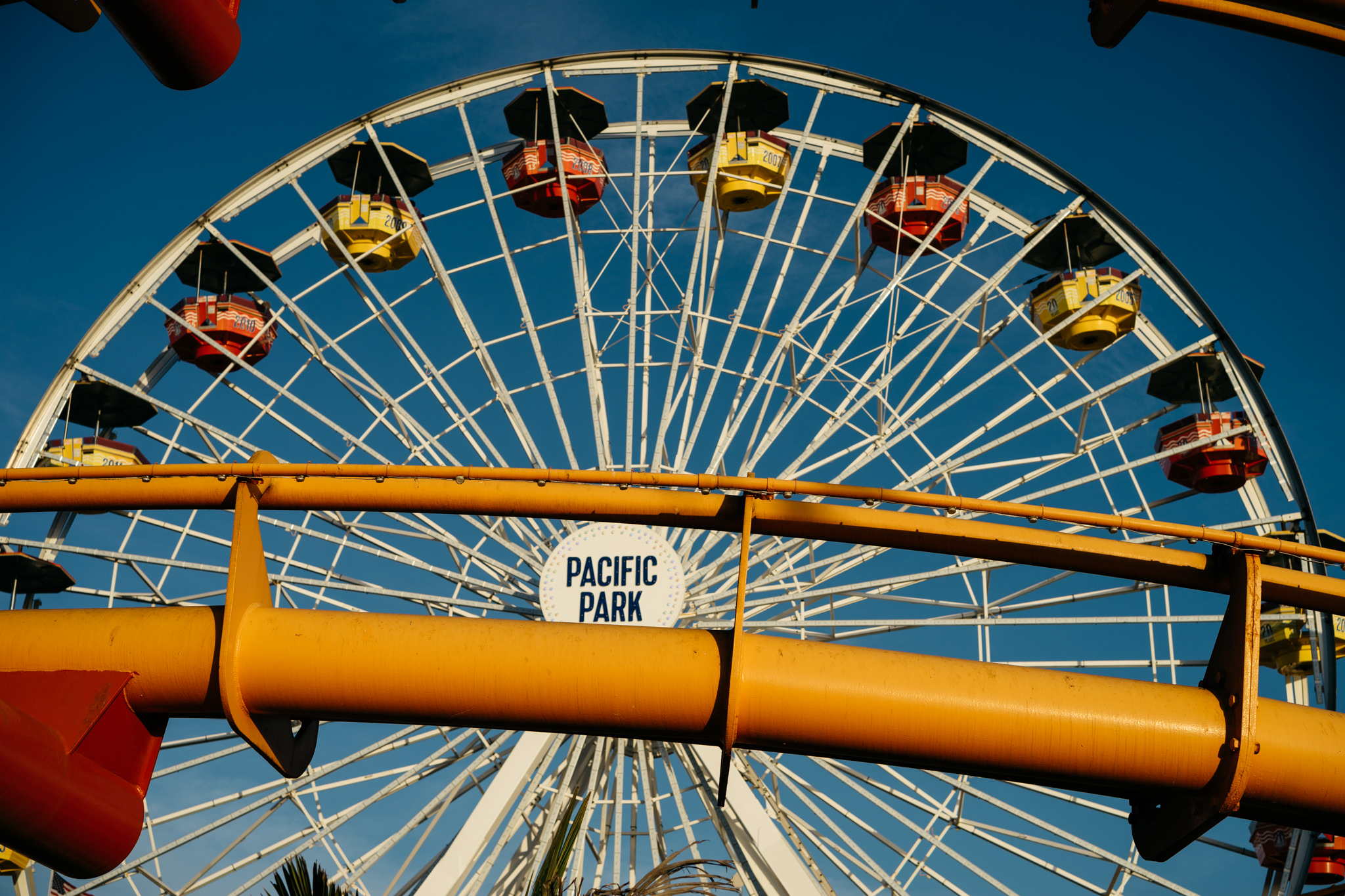 Santa Monica Pier Ferris wheel with Pacific Park sign.