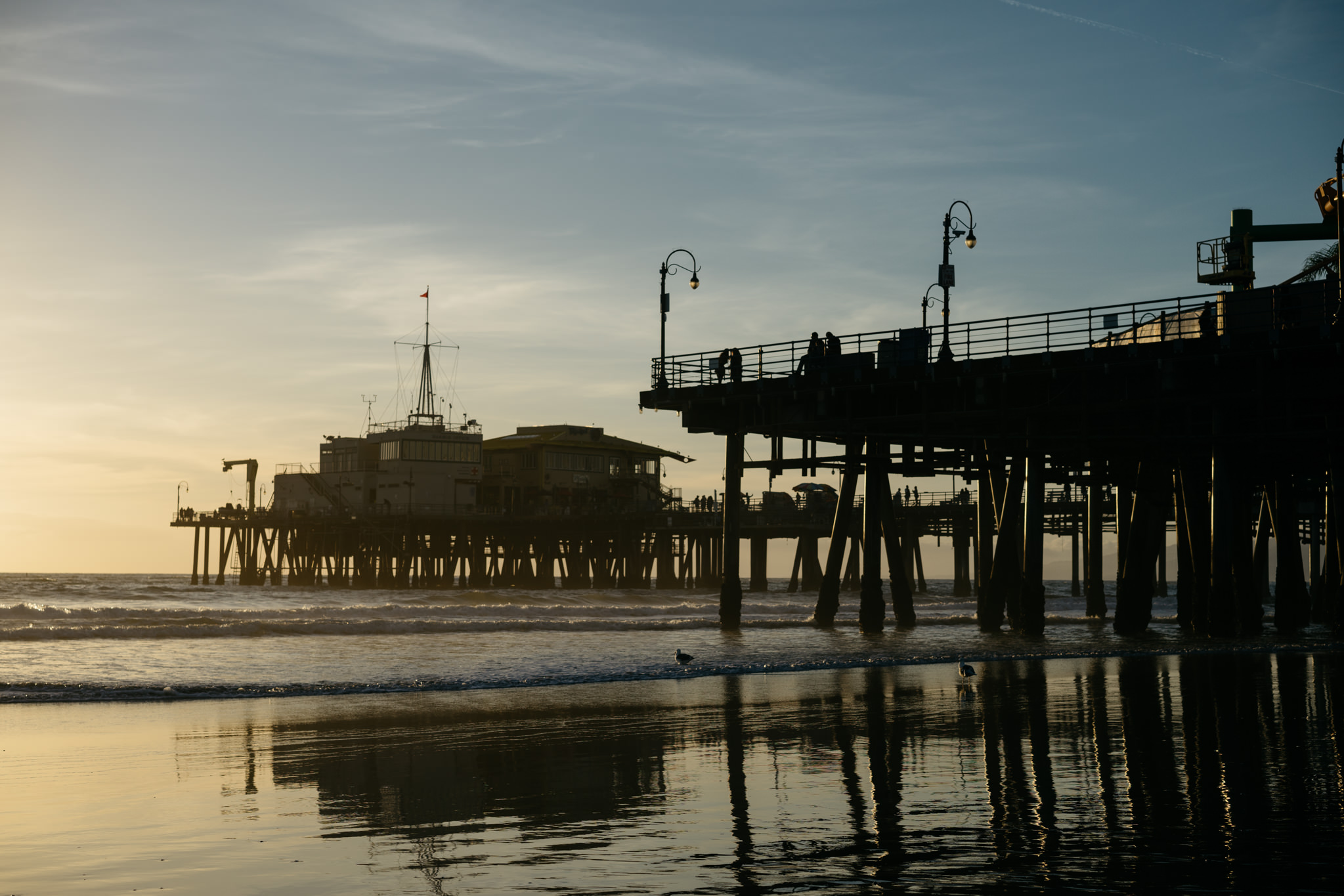 Silhouette of Santa Monica Pier at sunset.