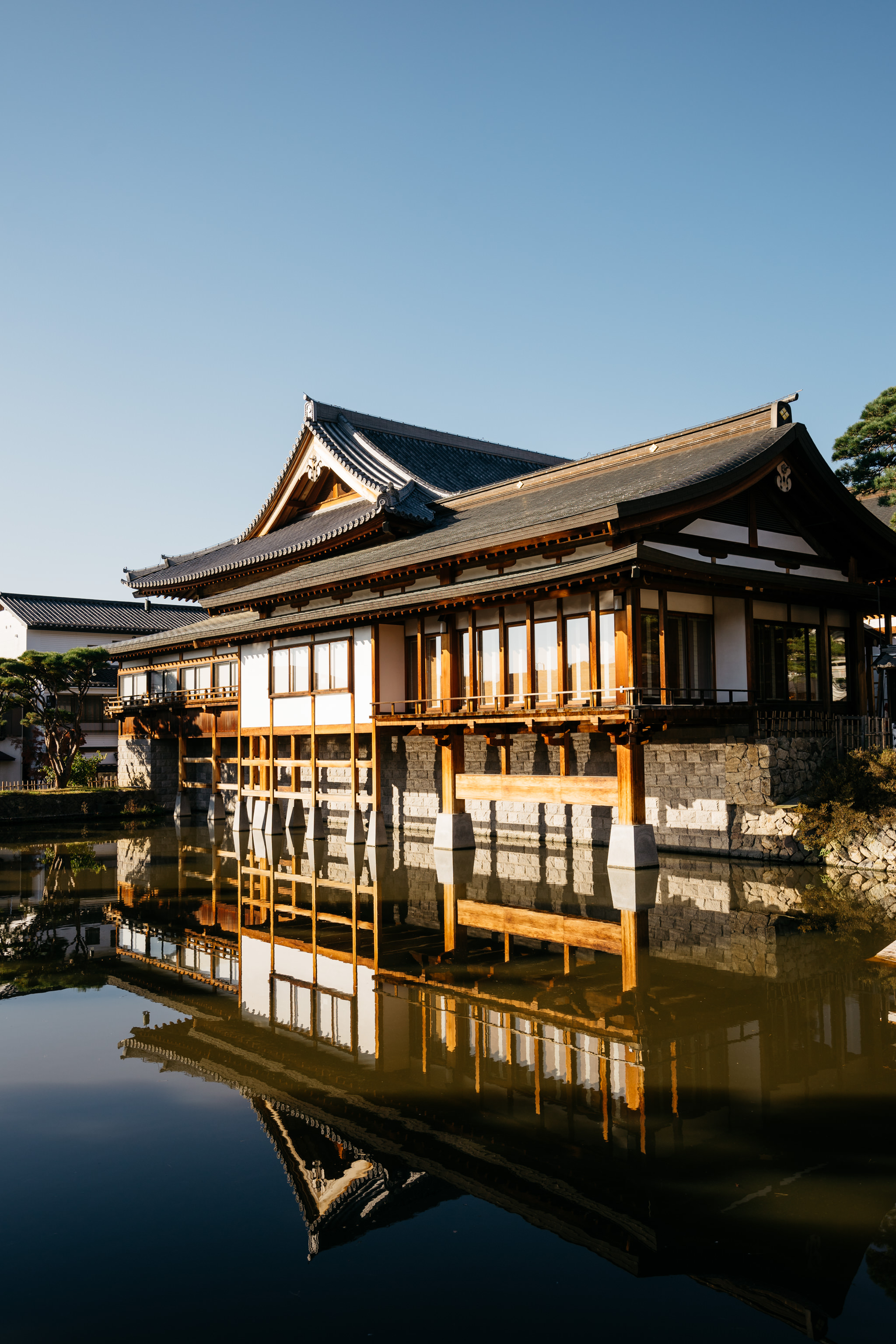 Zenko-ji Temple in Nagano, Japan reflected in still water.