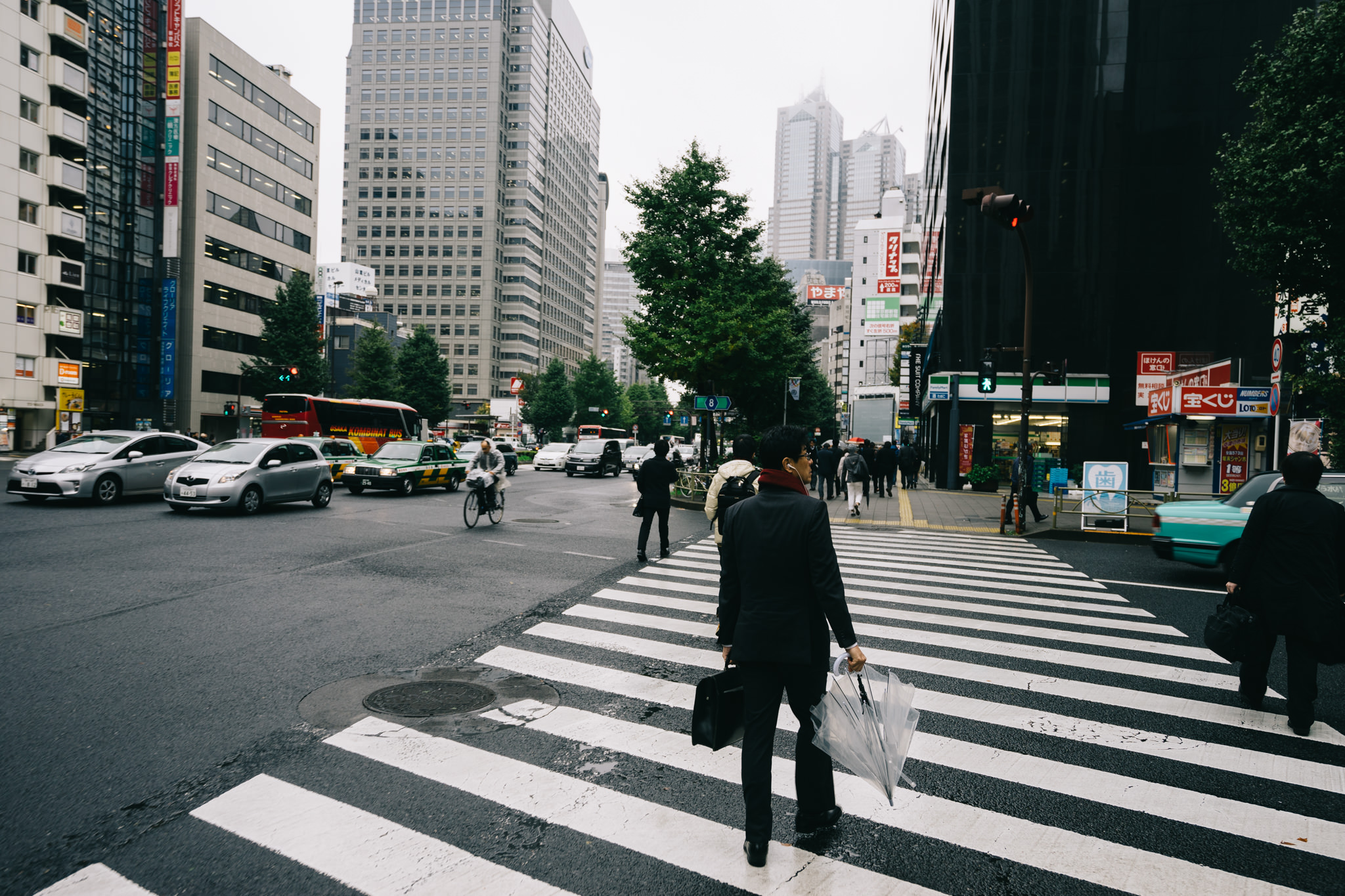Businessman crossing a street in Tokyo, Japan.