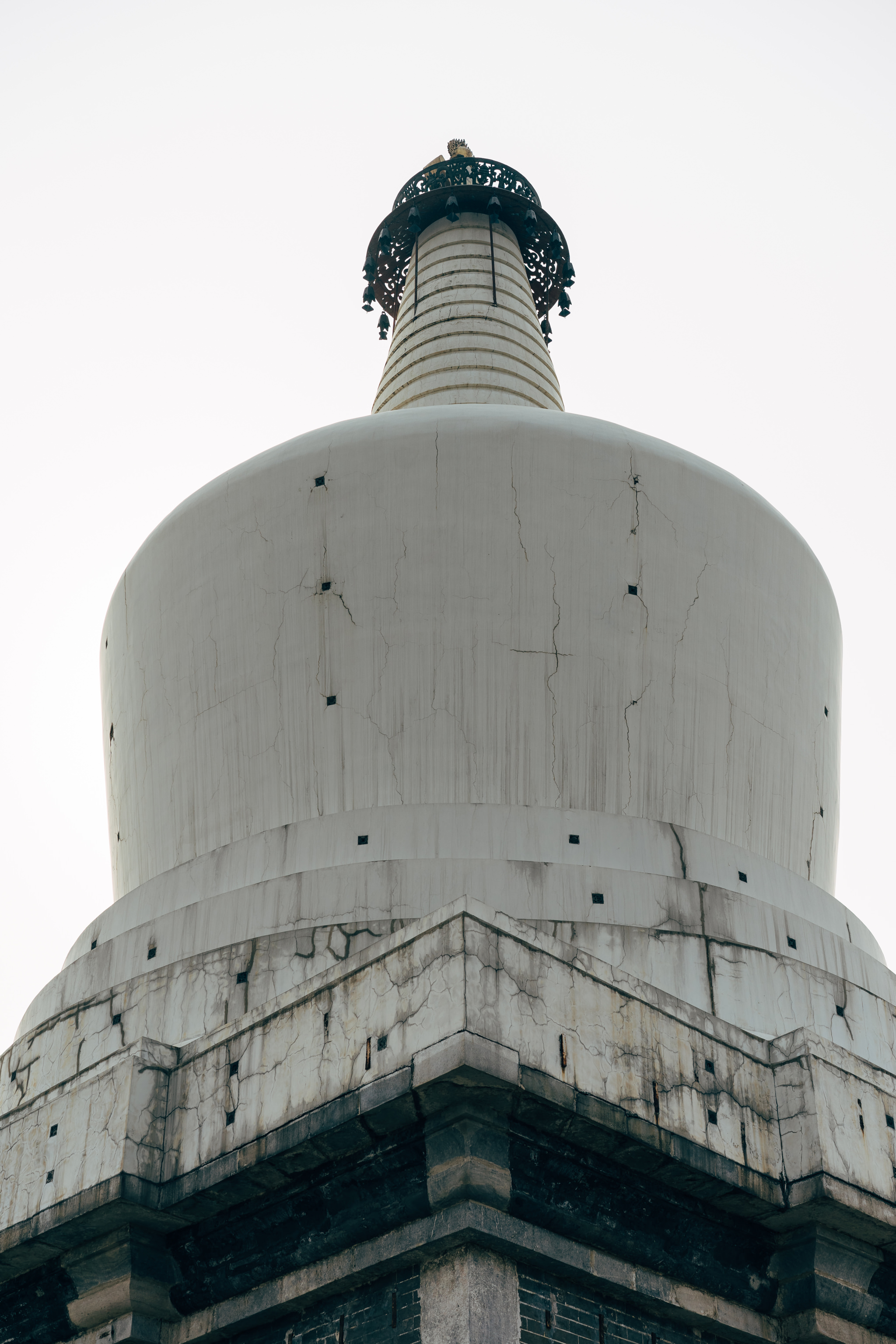 Close-up of a weathered white pagoda in Beihai Park, Beijing.