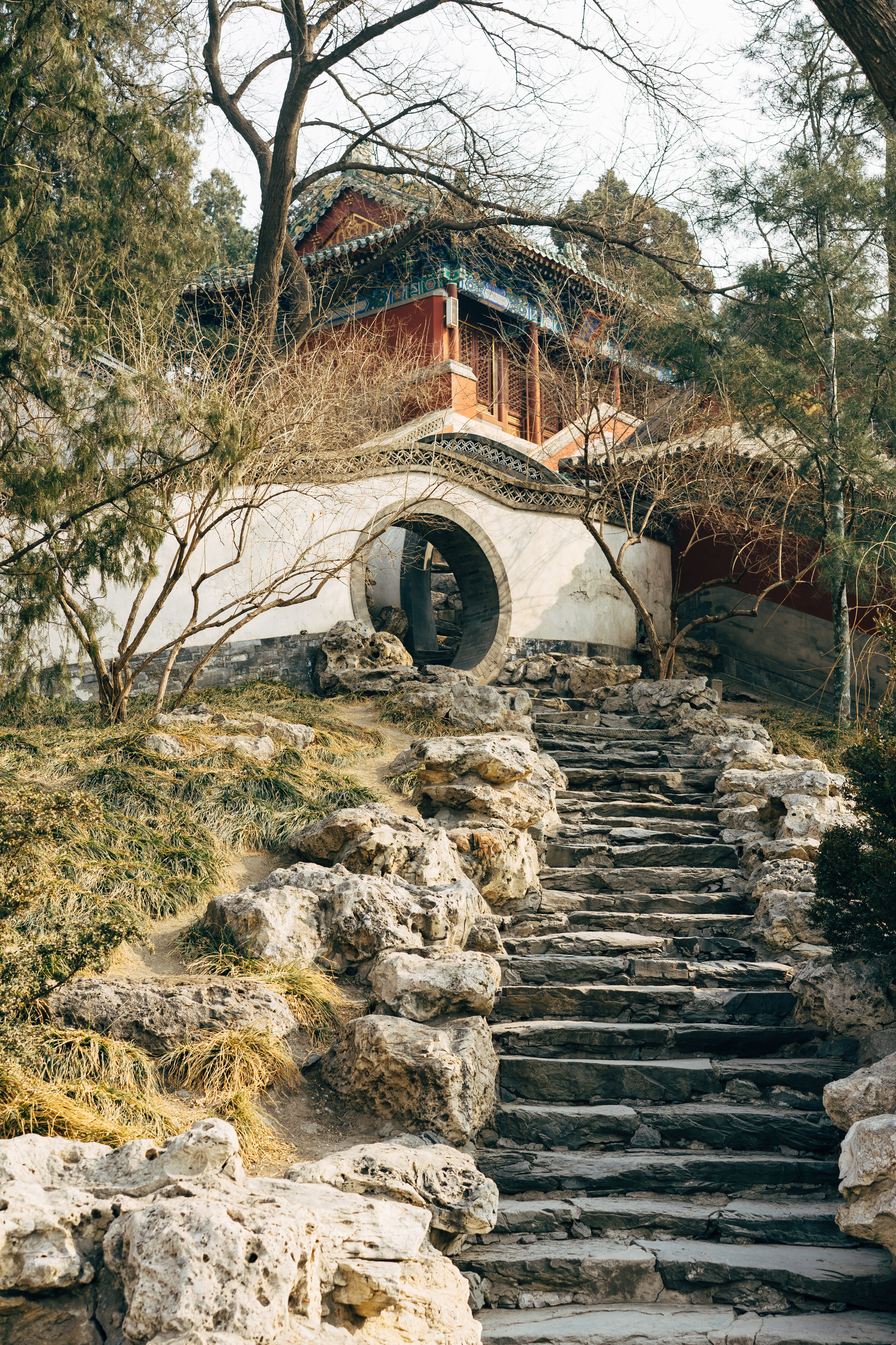 Stone steps leading to a traditional Chinese building in Beihai Park, Beijing.