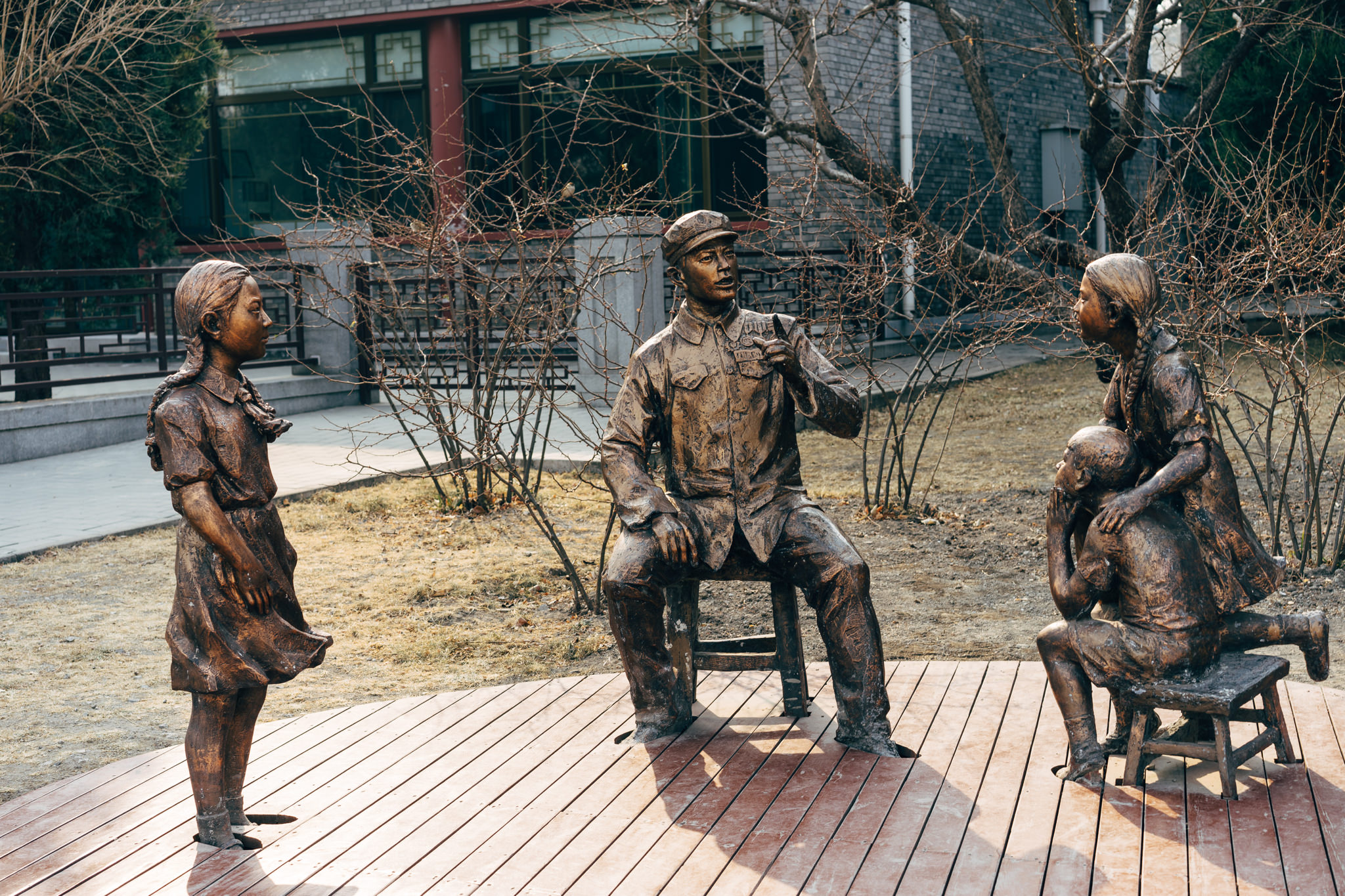 Bronze statue of a teacher and three students in Beihai Park, Beijing.