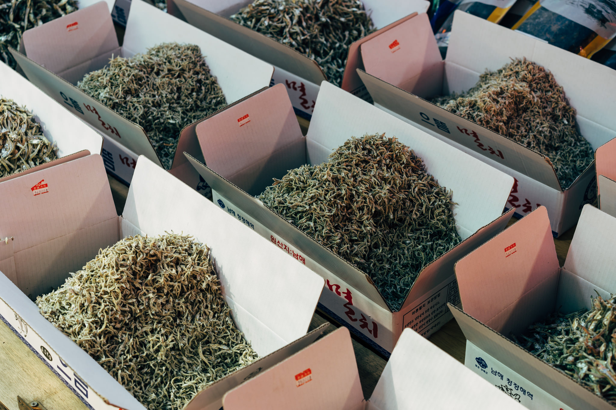 Busan fish market: numerous boxes of dried fish.