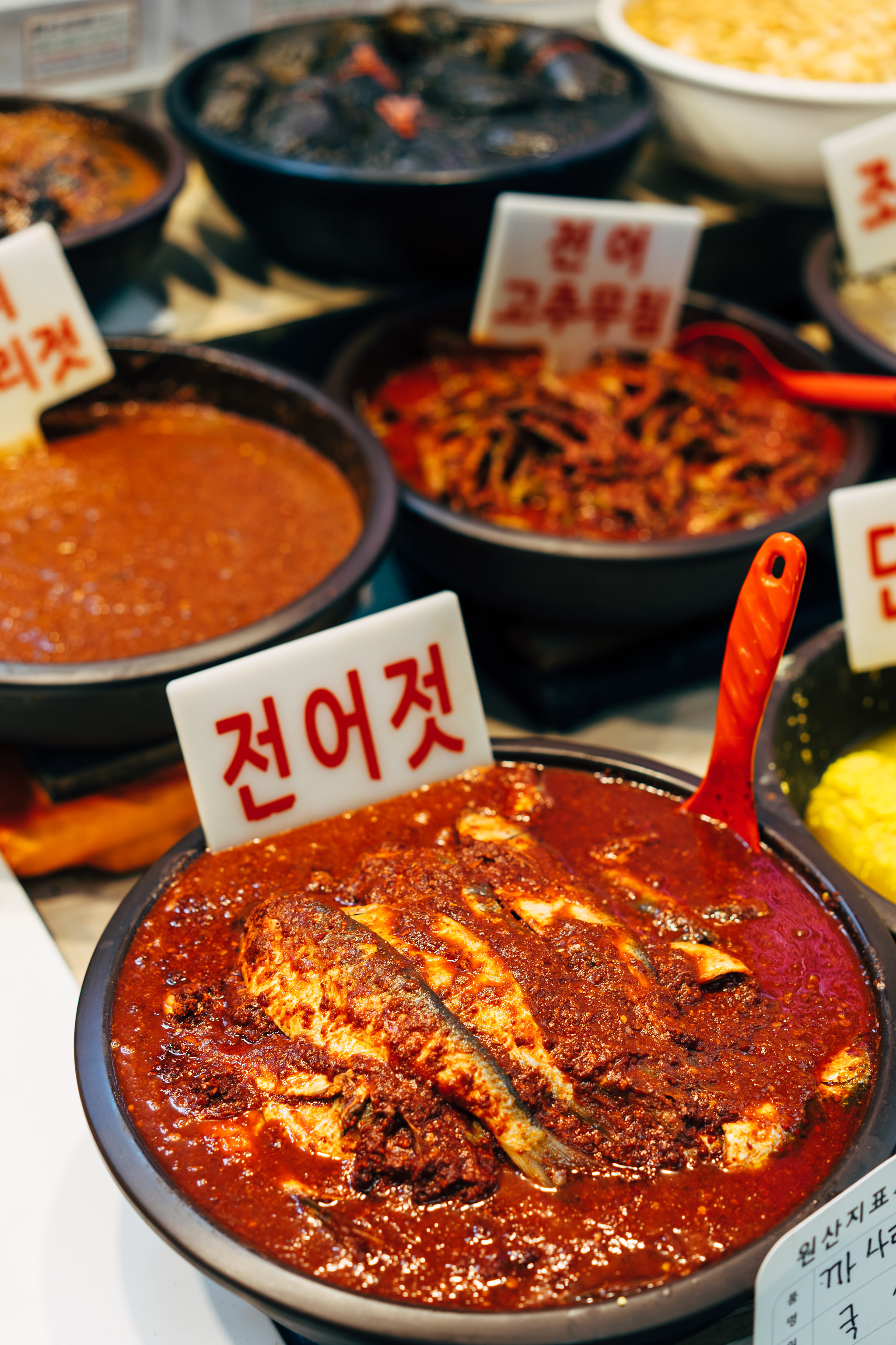 Spicy fermented fish in a bowl at a Busan market.