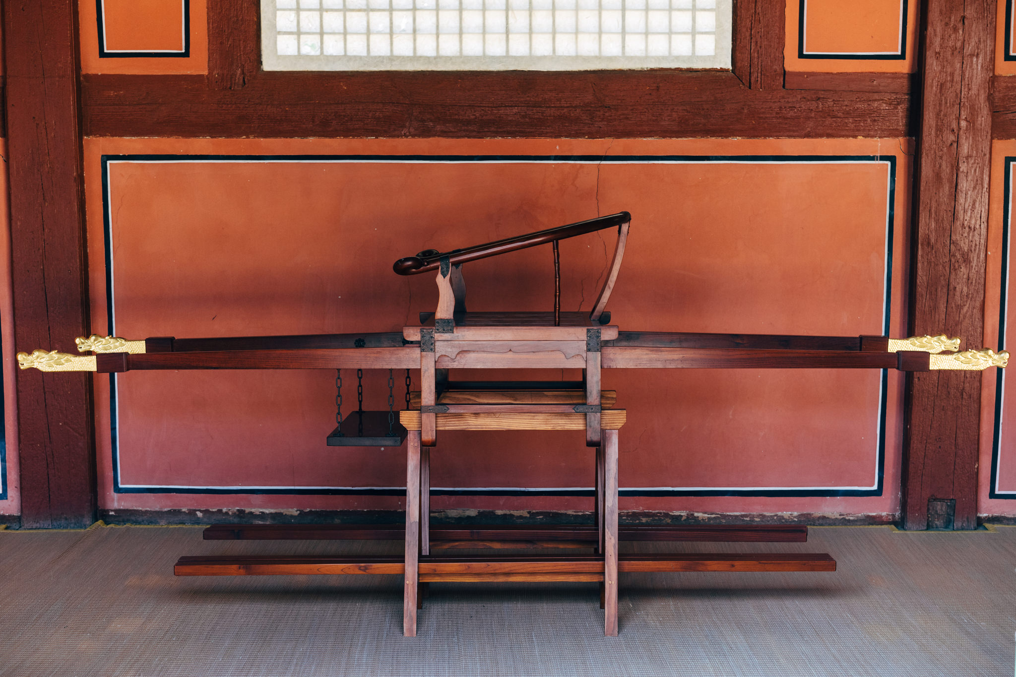 Wooden palanquin with gold dragon head details, in Jongmyo Shrine.