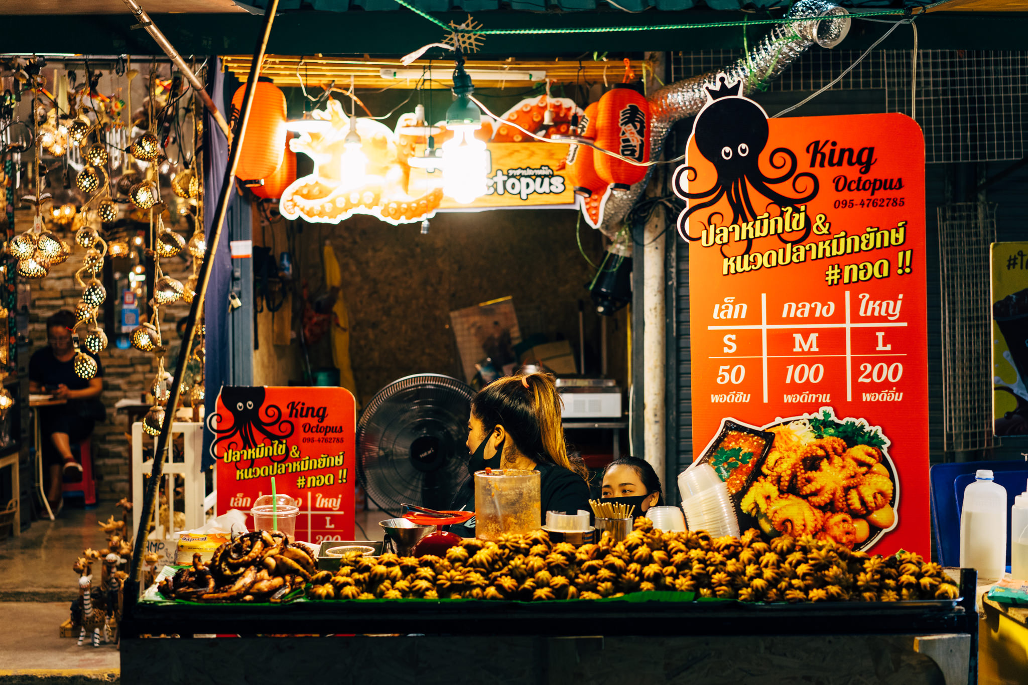Bangkok market stall selling king octopus.