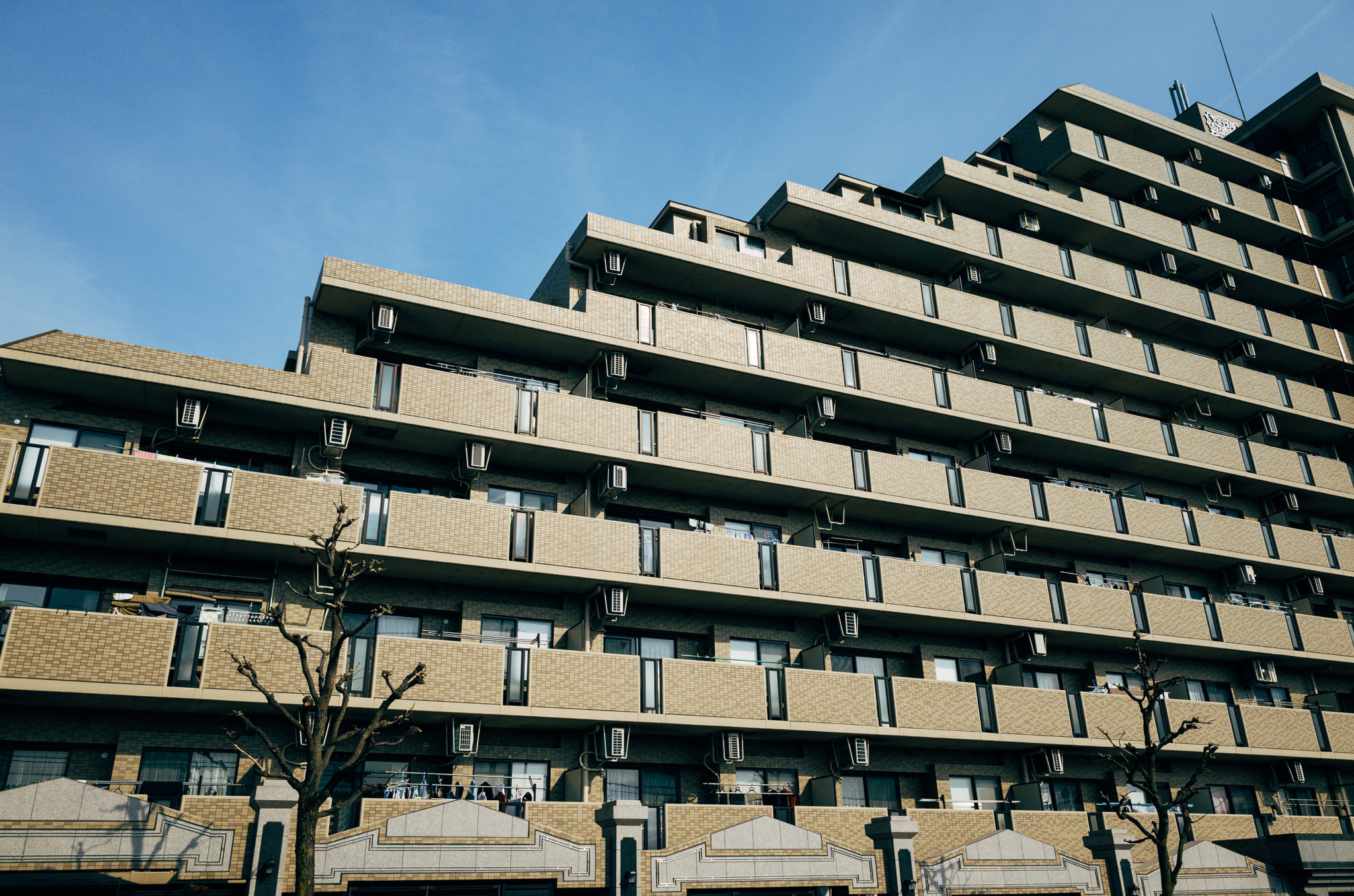 Tokyo apartment building with numerous balconies.