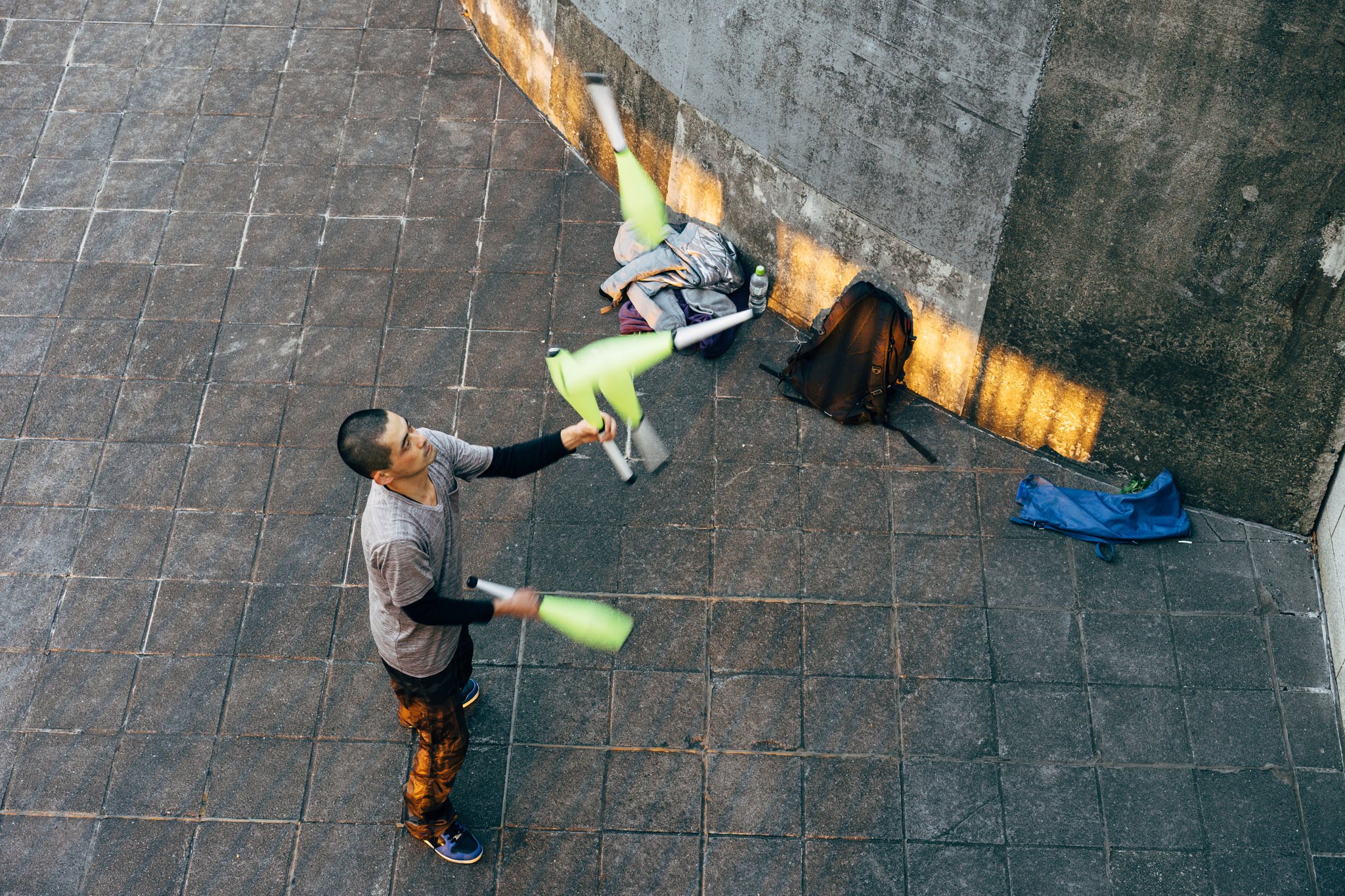Man juggling clubs in Tokyo.