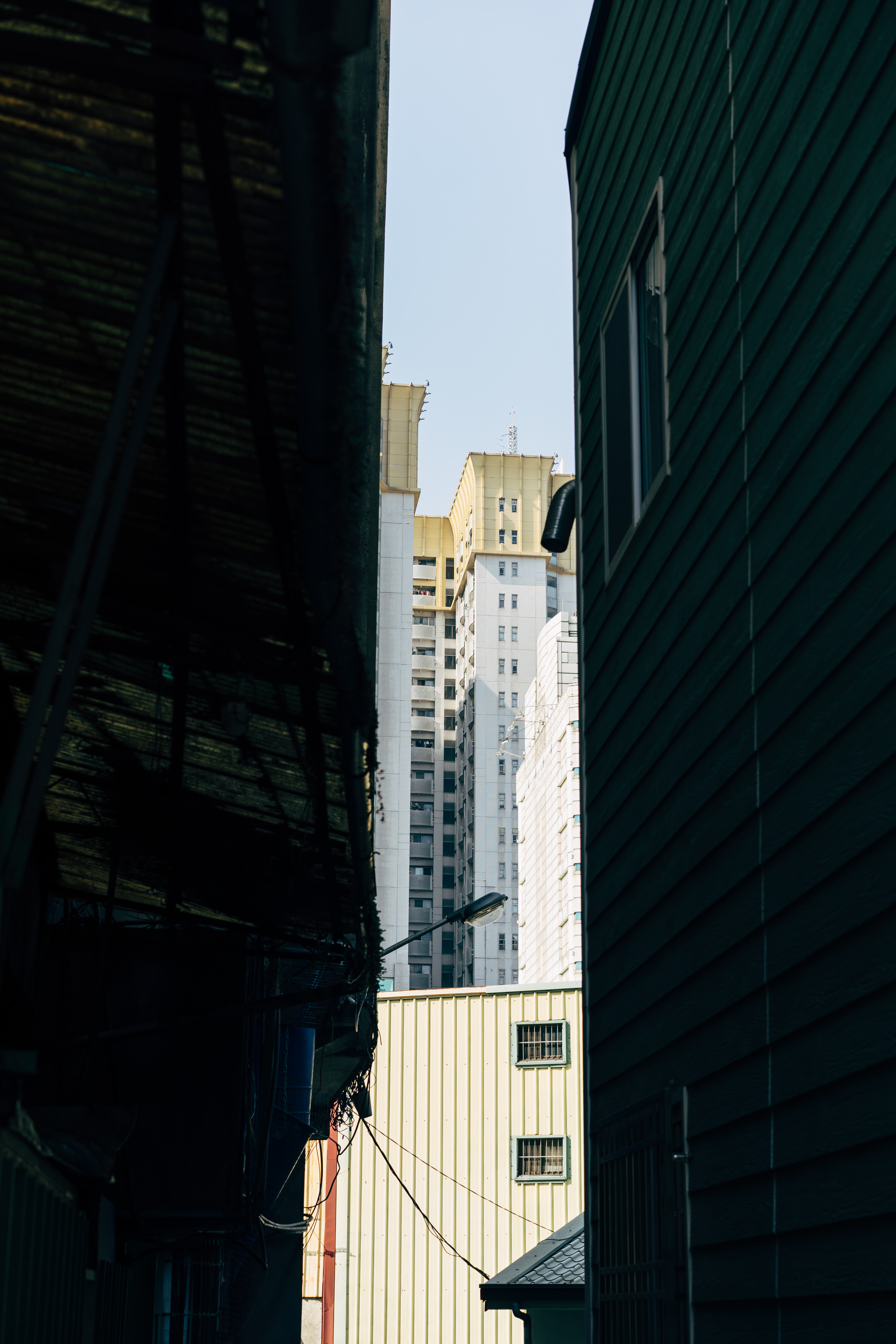 Taichung City apartment building viewed from a narrow alley.