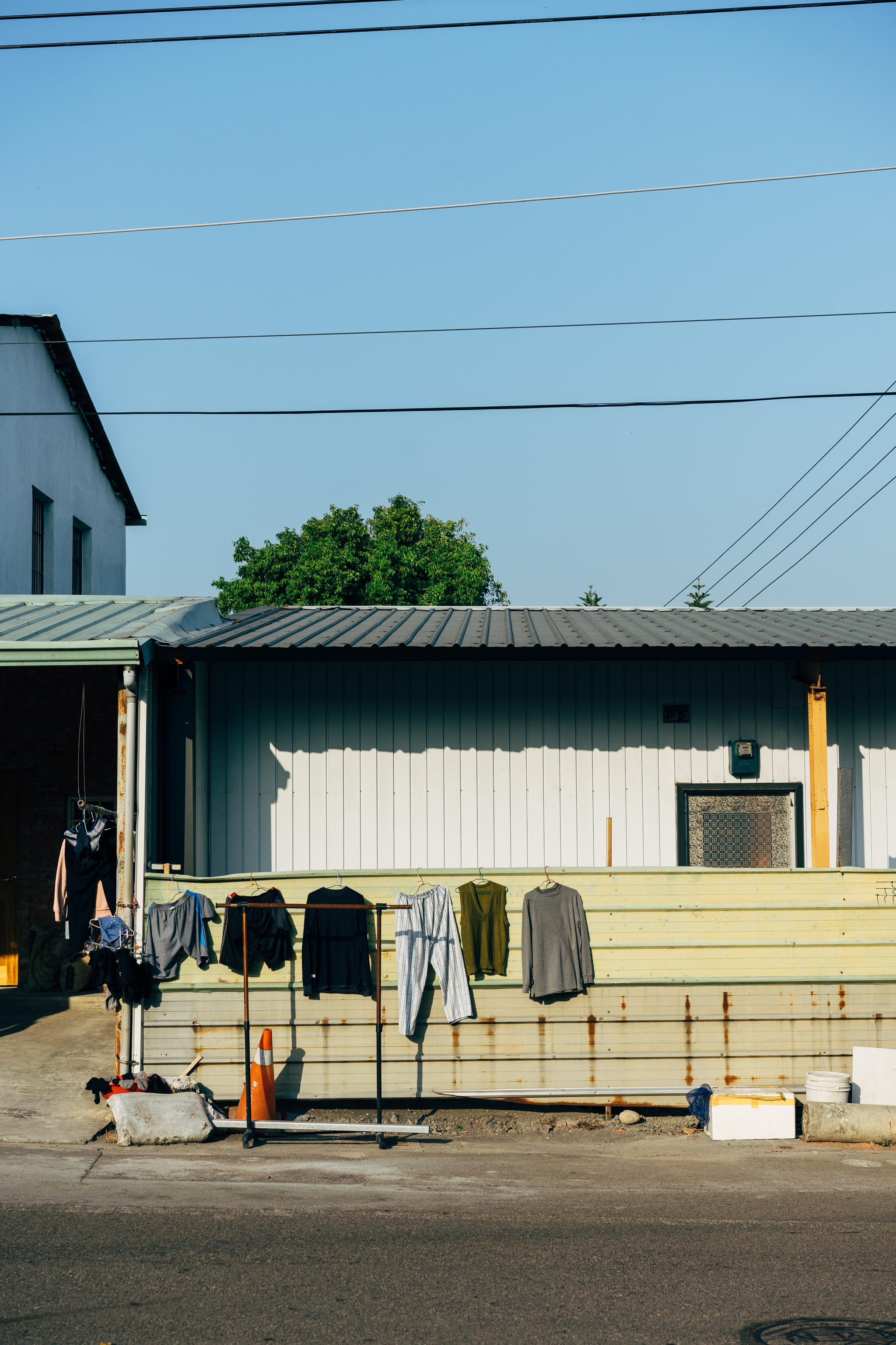Clothes hanging on a line outside a building in Taichung City.