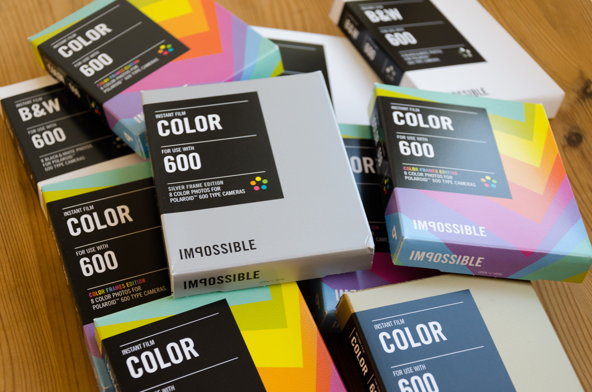 Several boxes of Impossible Project instant film for Polaroid 600 cameras.