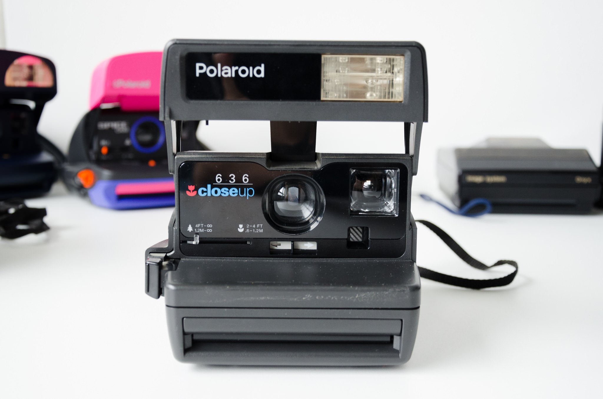 Black Polaroid 636 Closeup camera with built-in flash.