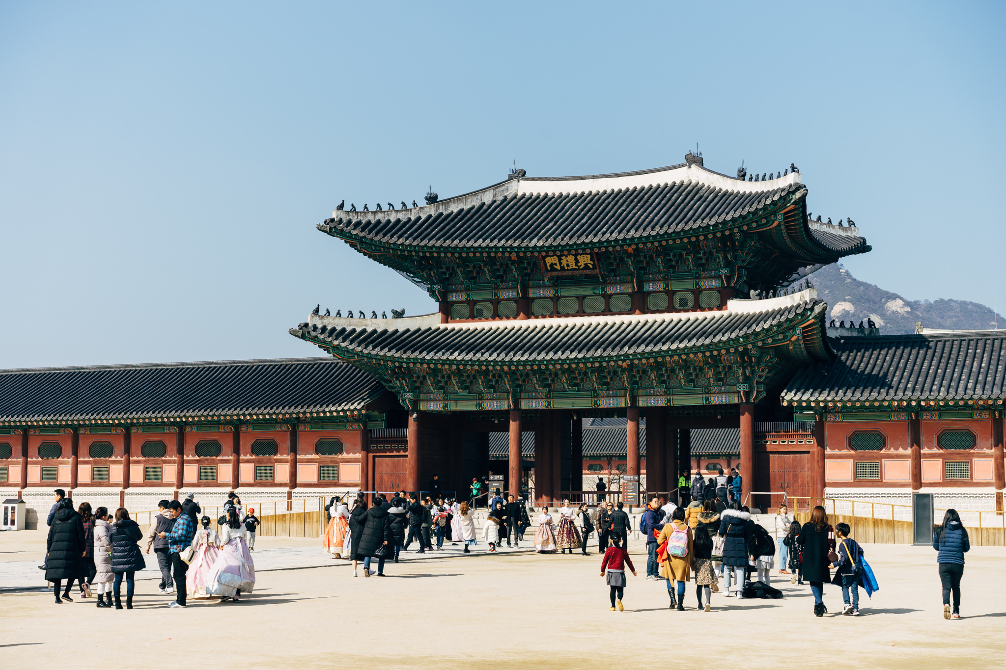 Gyeongbokgung Palace gate with many visitors.