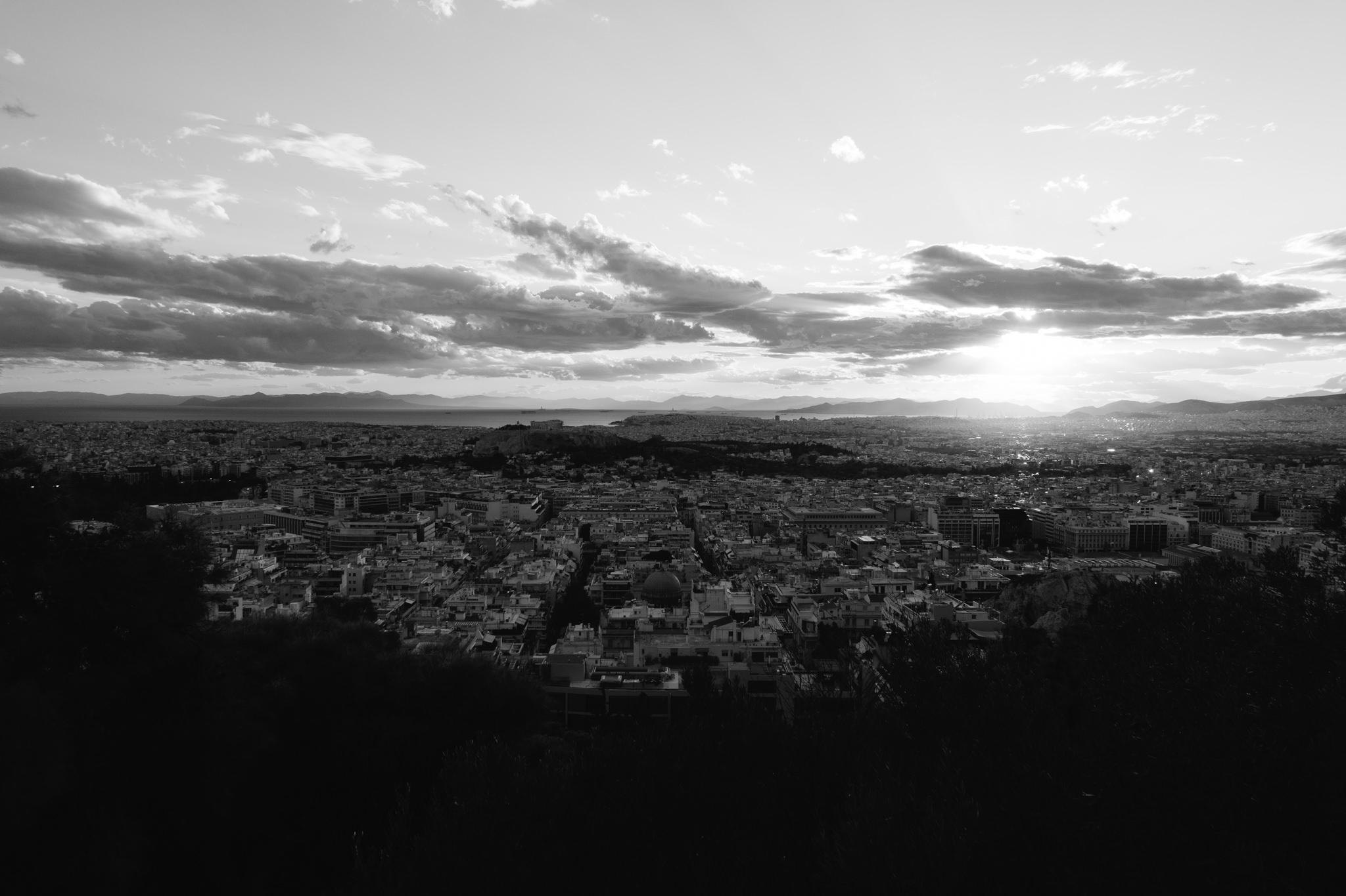 Black and white panoramic view of Athens, Greece at sunset.