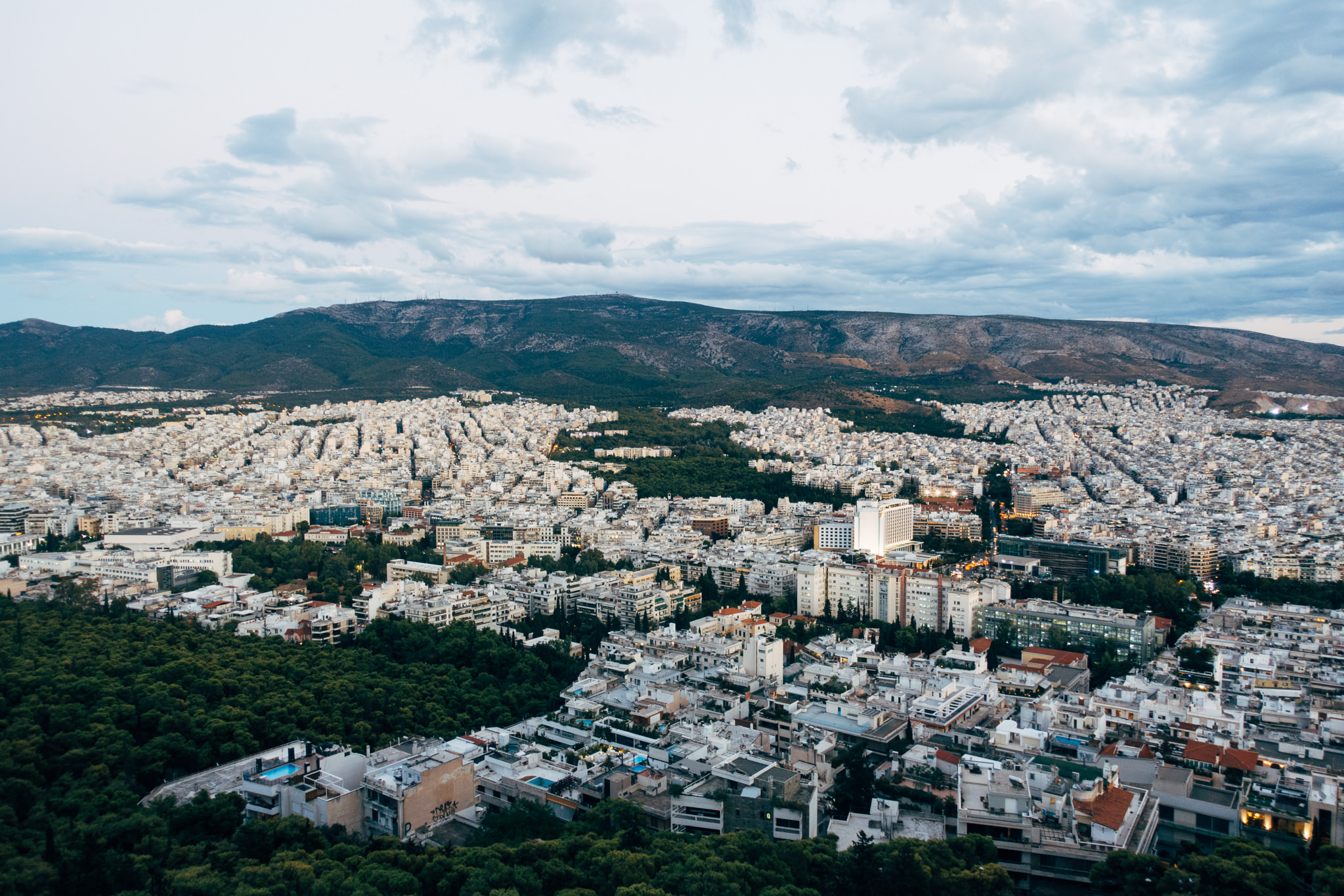 Aerial view of Athens, Greece, showing the city sprawling beneath Mount Lycabettus.