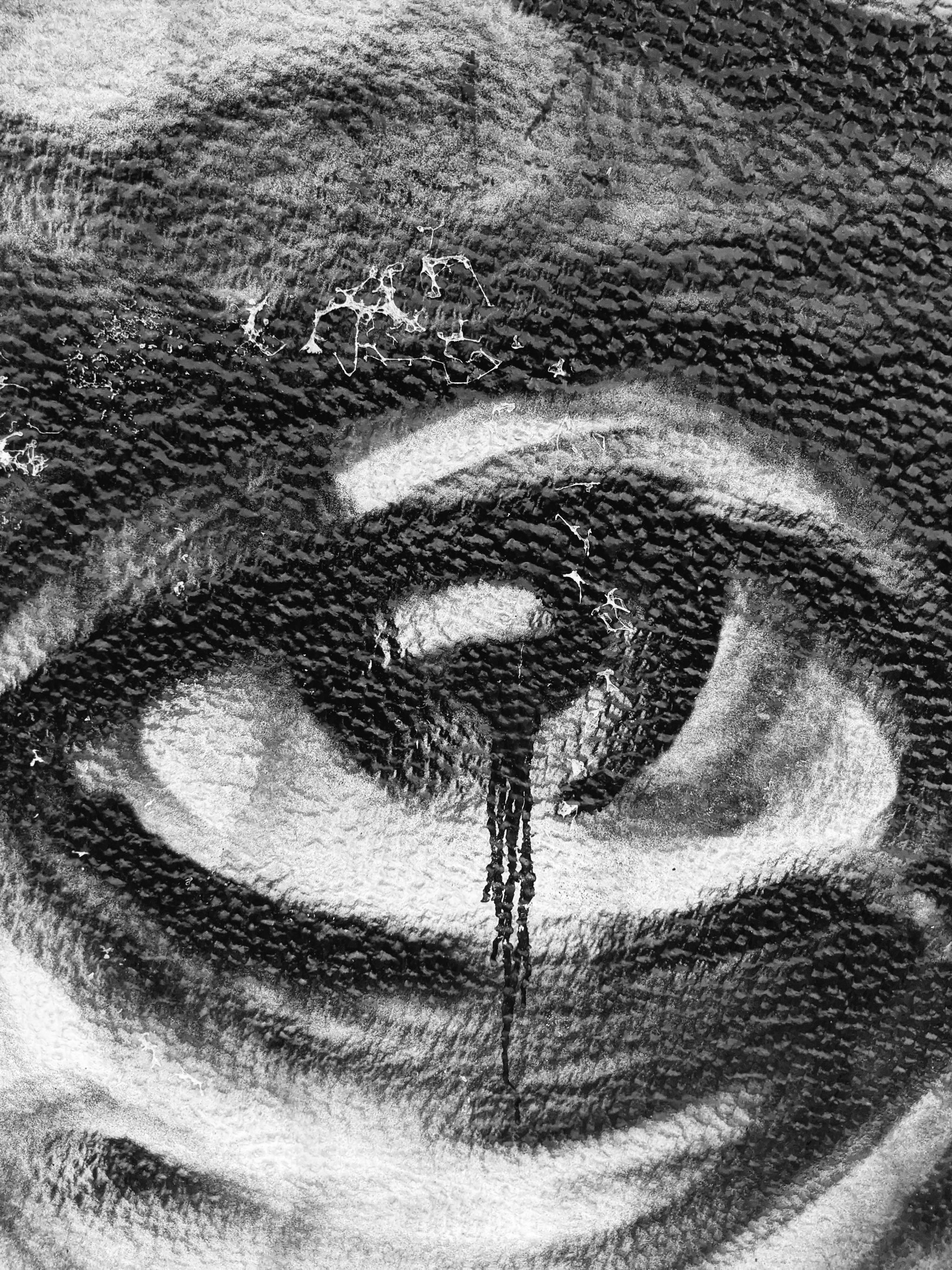 Graffiti of an eye in black and white.