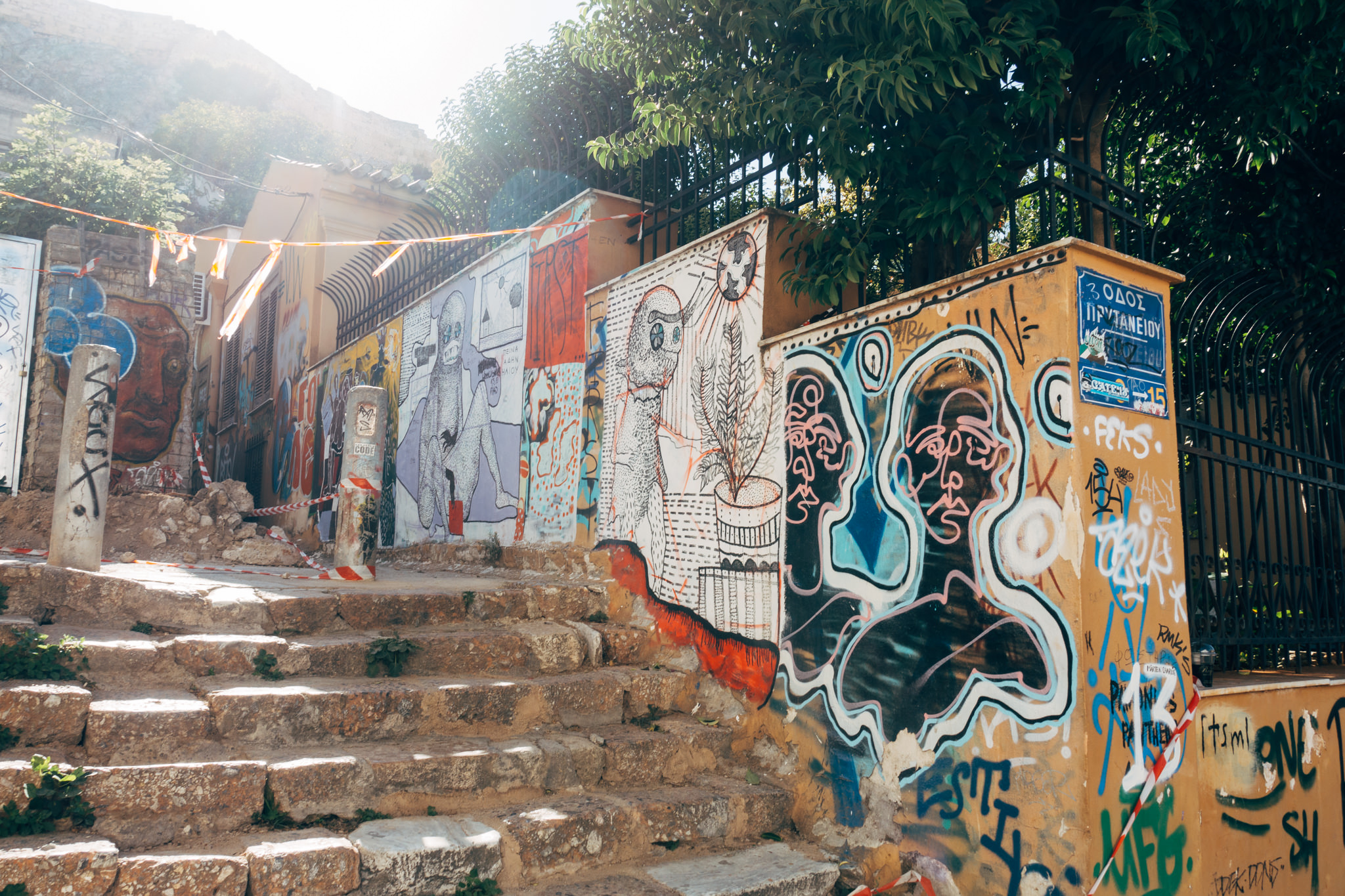 Stone stairs lined with colorful graffiti art.