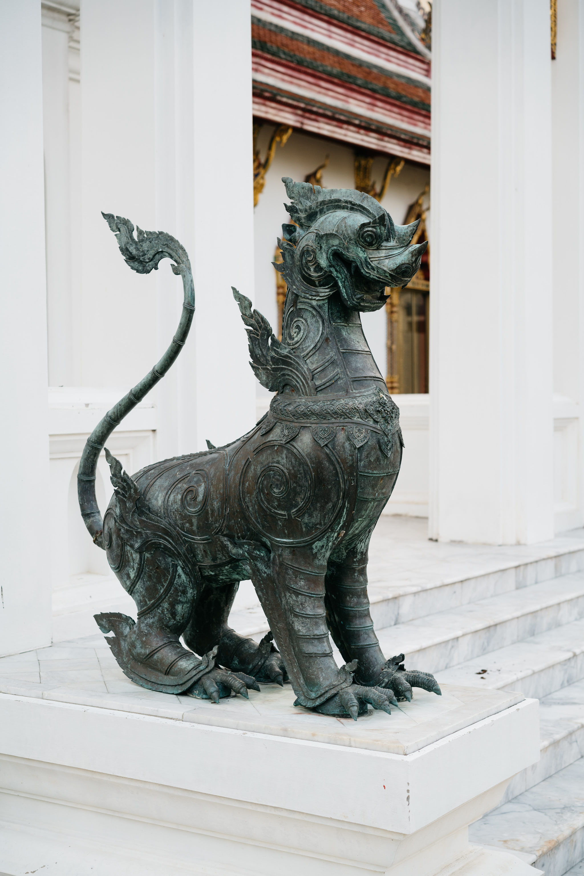 Ornate bronze lion statue at Wat Benchamabophit in Bangkok.
