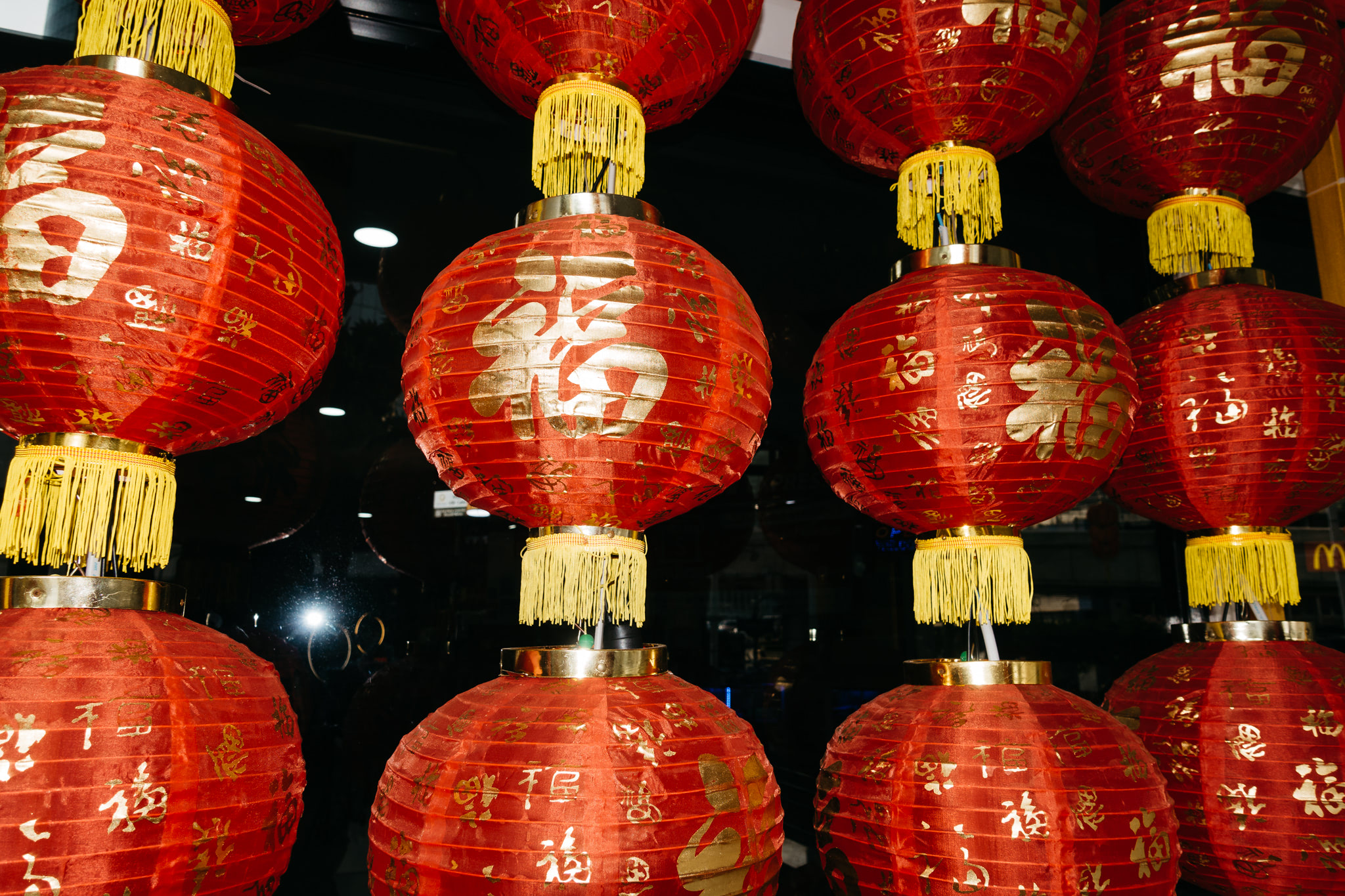 Red Chinese lanterns with gold characters.