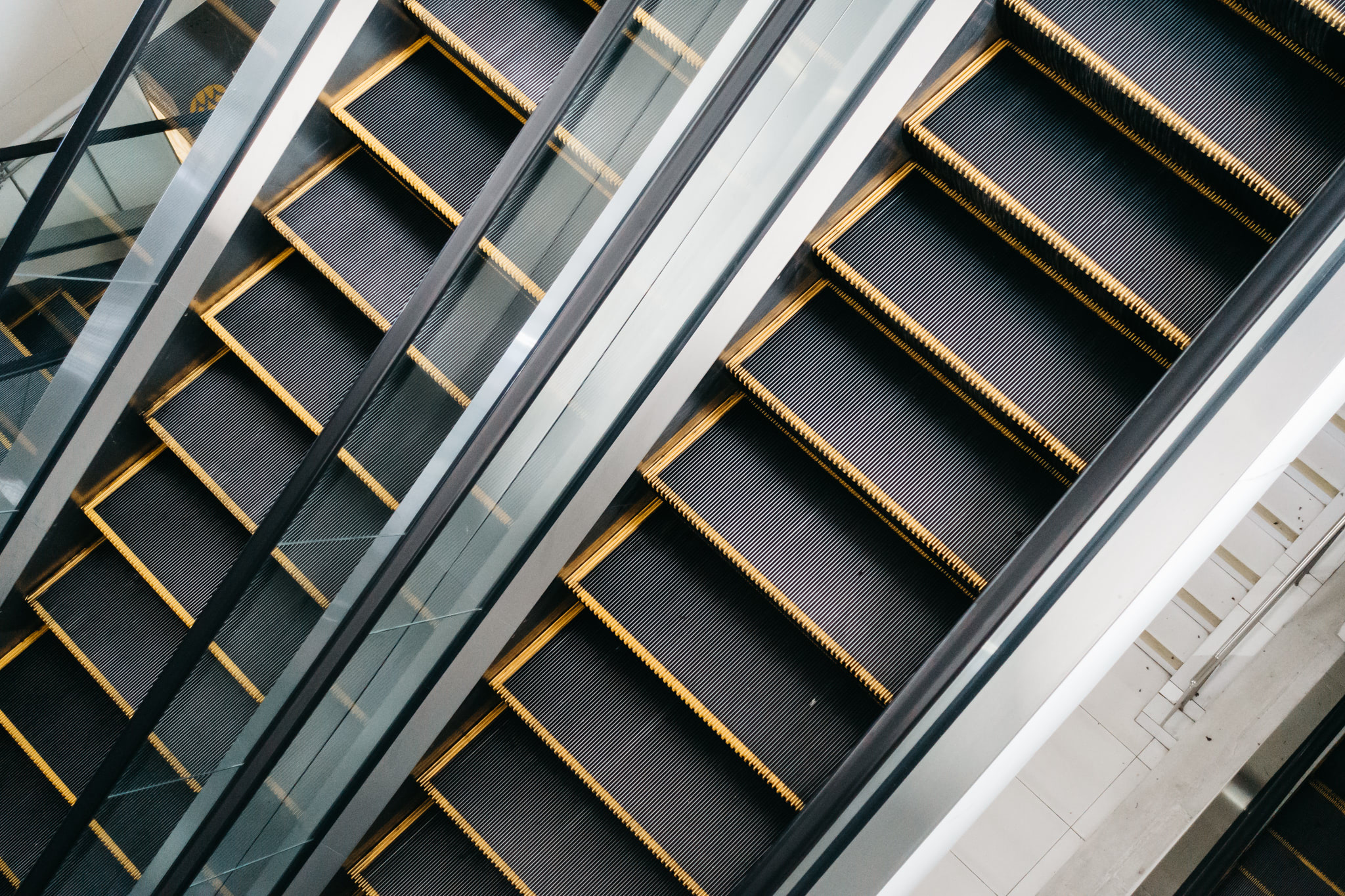 Two escalators from an overhead perspective.