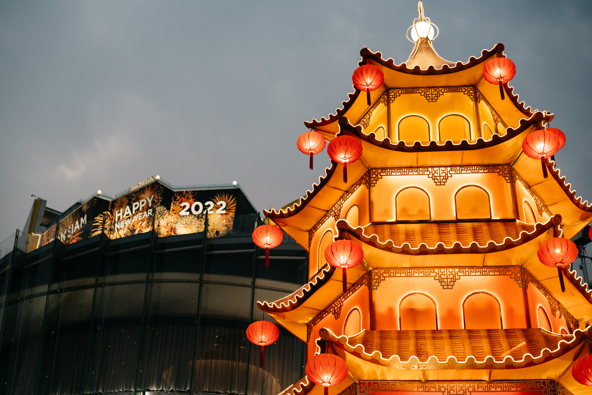 Illuminated pagoda with red lanterns at Iconsiam, Bangkok, celebrating 2022 Happy New Year.
