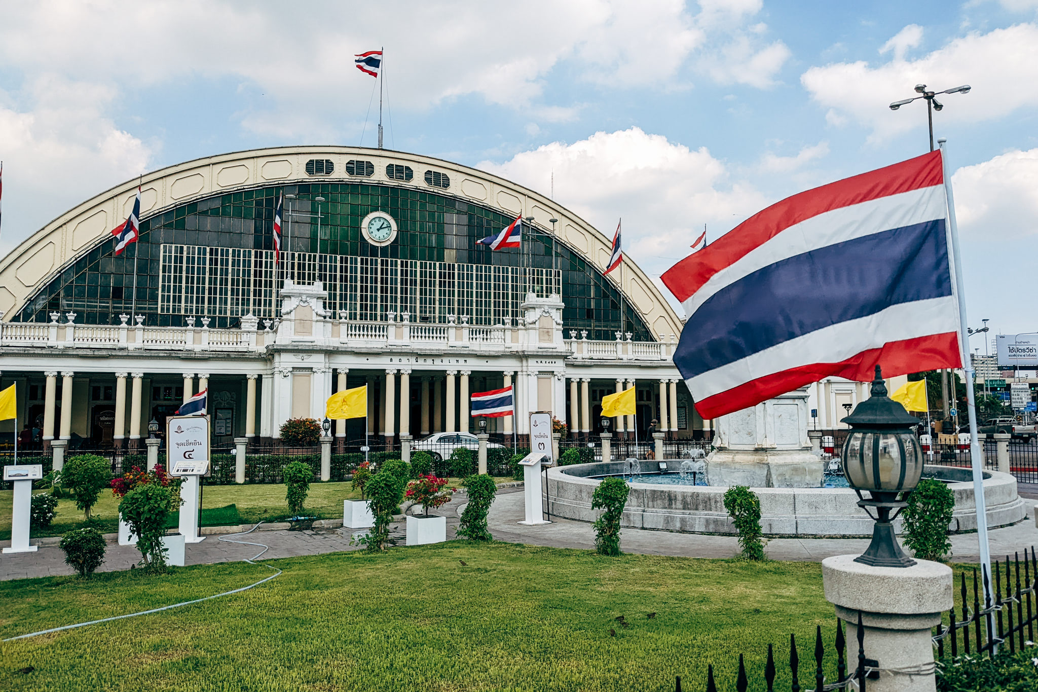 Bangkok Hua Lamphong Railway Station with Thai flags.