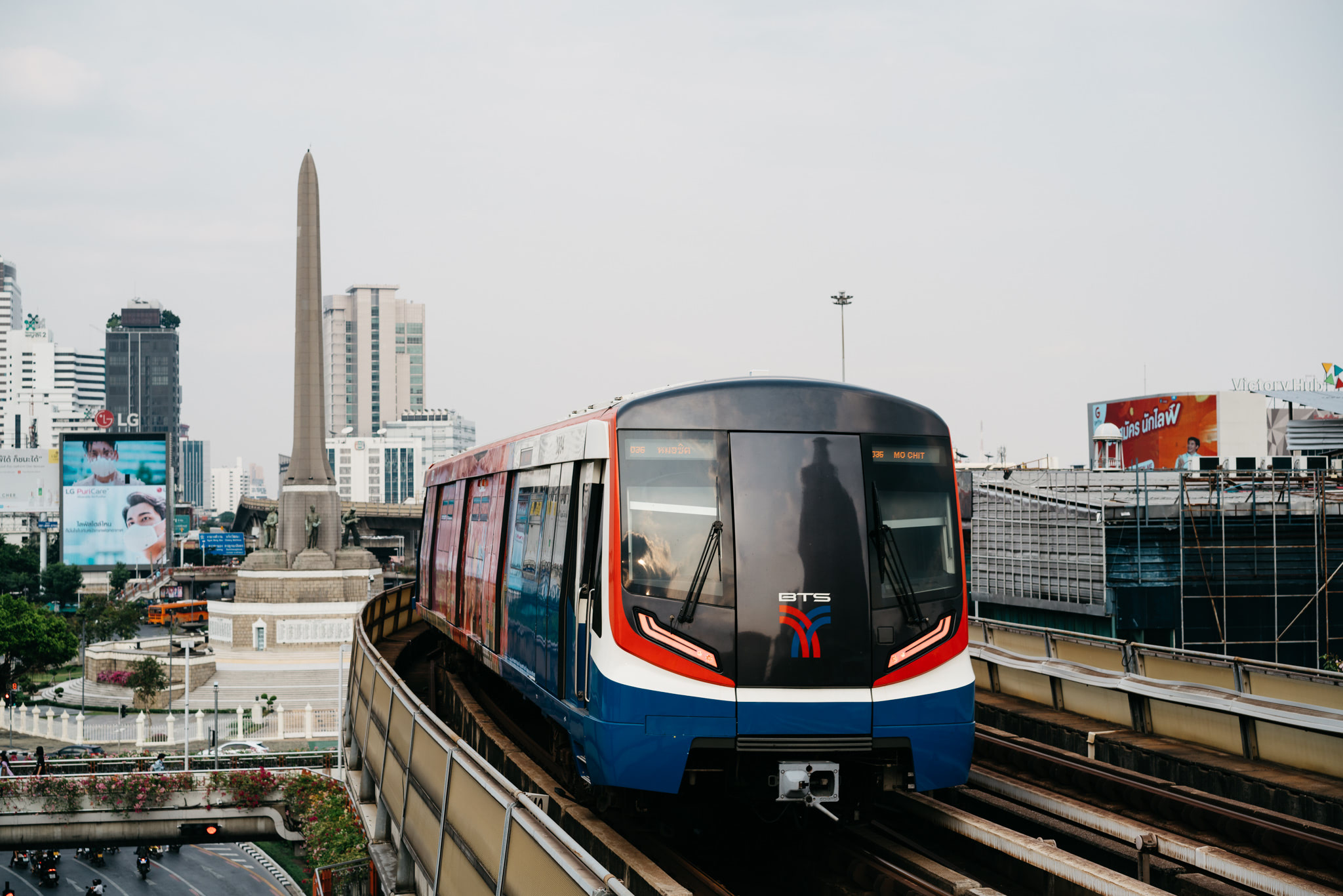 Bangkok BTS Skytrain approaching station.