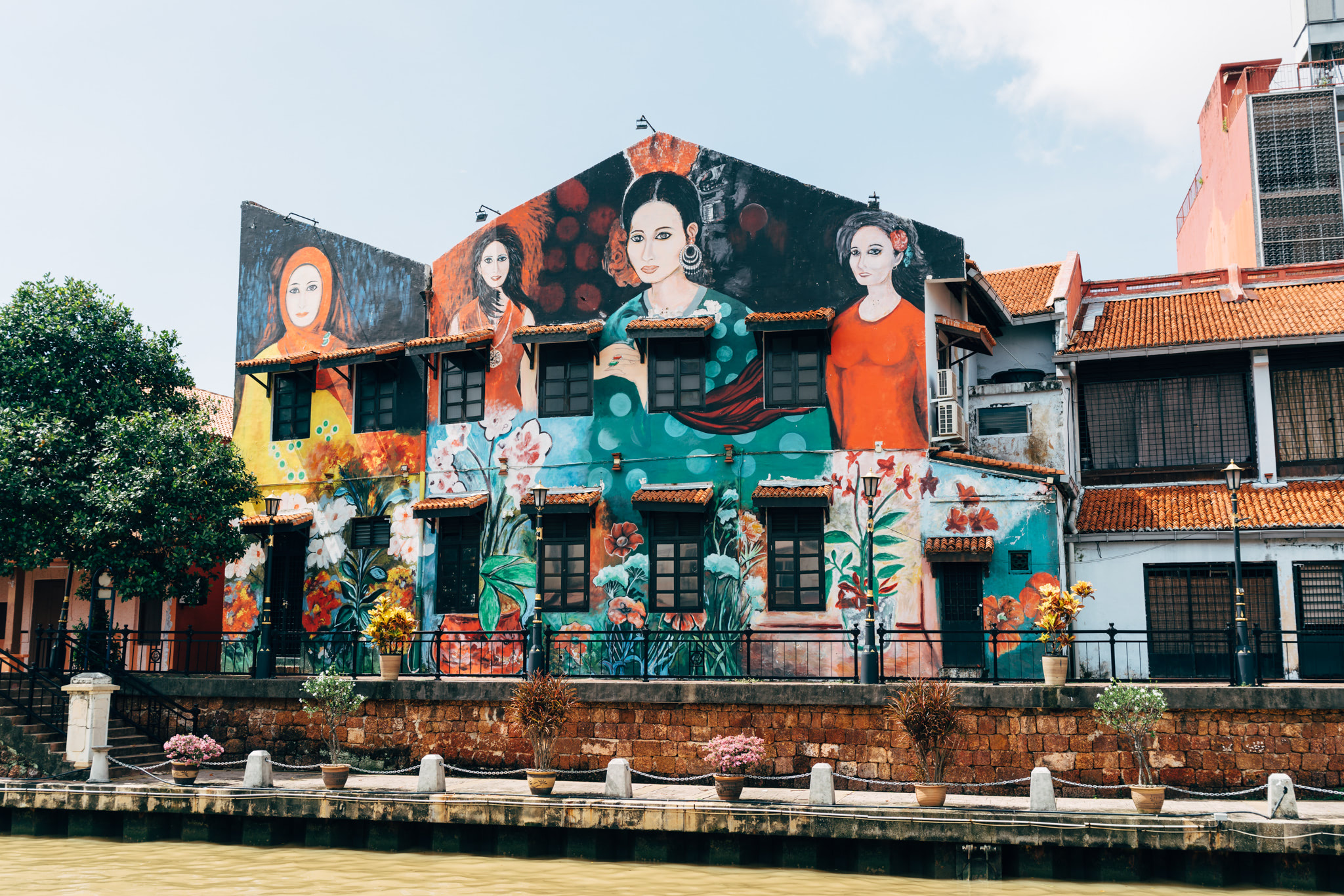 Mural of women on a building in Malacca, Malaysia.