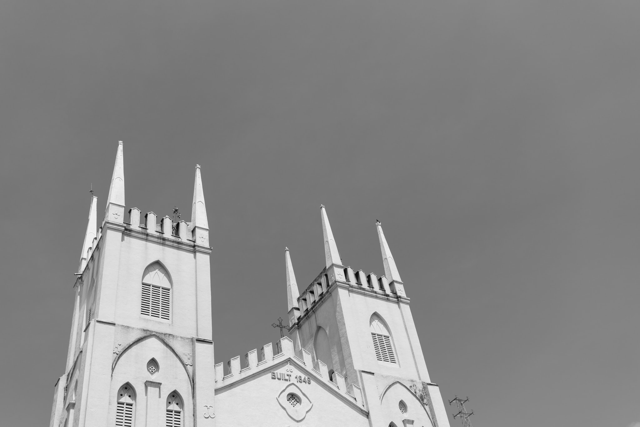 Black and white, low-angle view of the steeple of a church, built in 1849.