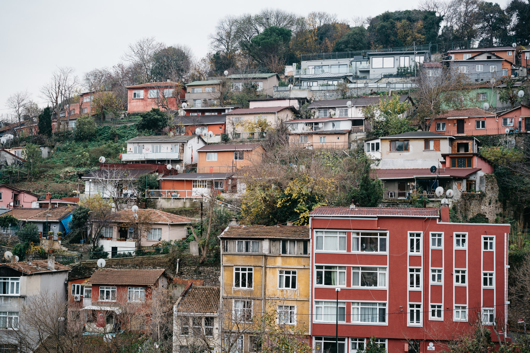 Densely packed colorful houses on a hillside in Istanbul.