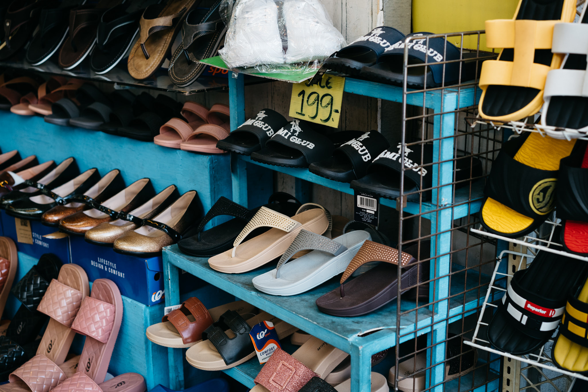 Assortment of sandals and shoes on display in a Chinese shoe store.